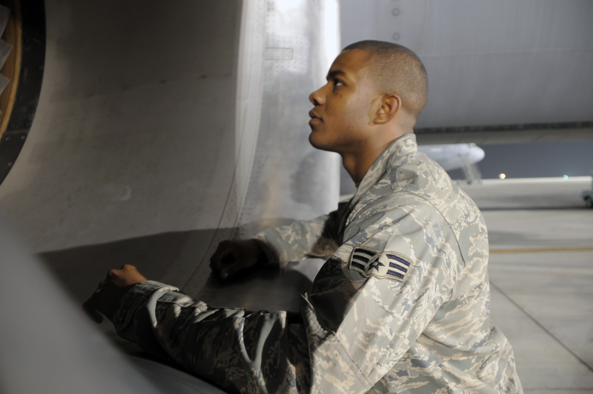 Senior Airman Justin Lassiter, KC-10 Extender aerospace propulsion journeyman deployed with the 380th Expeditionary Aircraft Maintenance Squadron, looks over the enginer of a KC-10 at a non-disclosed base in Southwest Asia. His primary mission is to fix and maintain KC-10 aircraft engines and systems. He is on his third deployment with the 380th EAMXS. Airman Lassiter is deployed from the 605th Aircraft Maintenance Squadron at Joint Base McGuire-Dix-Lakehurst, N.J., and his hometown is Wilson, N.C. (U.S. Air Force Photo/Master Sgt. Scott T. Sturkol/Released)