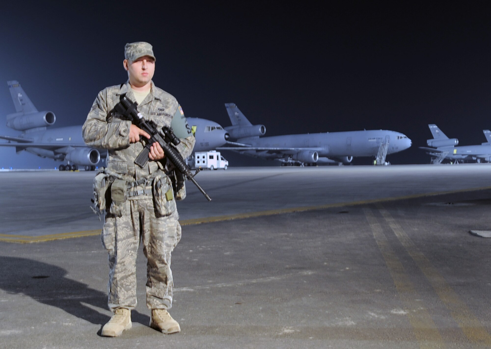 Senior Airman Christopher Burk, security forces journeyman with the 380th Expeditionary Security Forces Squadron, watches over the flightline at a non-disclosed base in Southwest Asia on Jan. 31, 2010. Security forces Airmen like Airman Burk are in charge of protecting and providing security for thousands of deployed service members and millions of dollars worth of deployed military assets and equipment. Airman Burk is deployed from the 81st Security Forces Squadron at Keesler Air Force Base, Miss., and his hometown is Ocean Springs, Miss.  (U.S. Air Force Photo/Master Sgt. Scott T. Sturkol/Released)