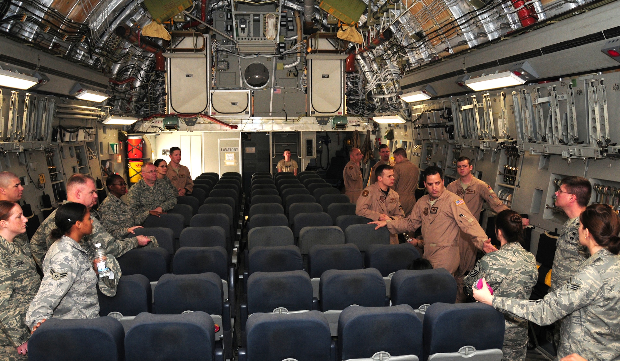 U.S. Air Force Master Sgt. Bill Flanders, 817th Expeditionary Airlift Squadron C-17 loadmaster, shows 386th Air Expeditionary Wing members the C-17 Globemaster Jan. 30, 2010 during the Quarry Open House at an air base in Southwest Asia. (U.S. Air Force photo by Staff Sgt. Lakisha A. Croley/Released)