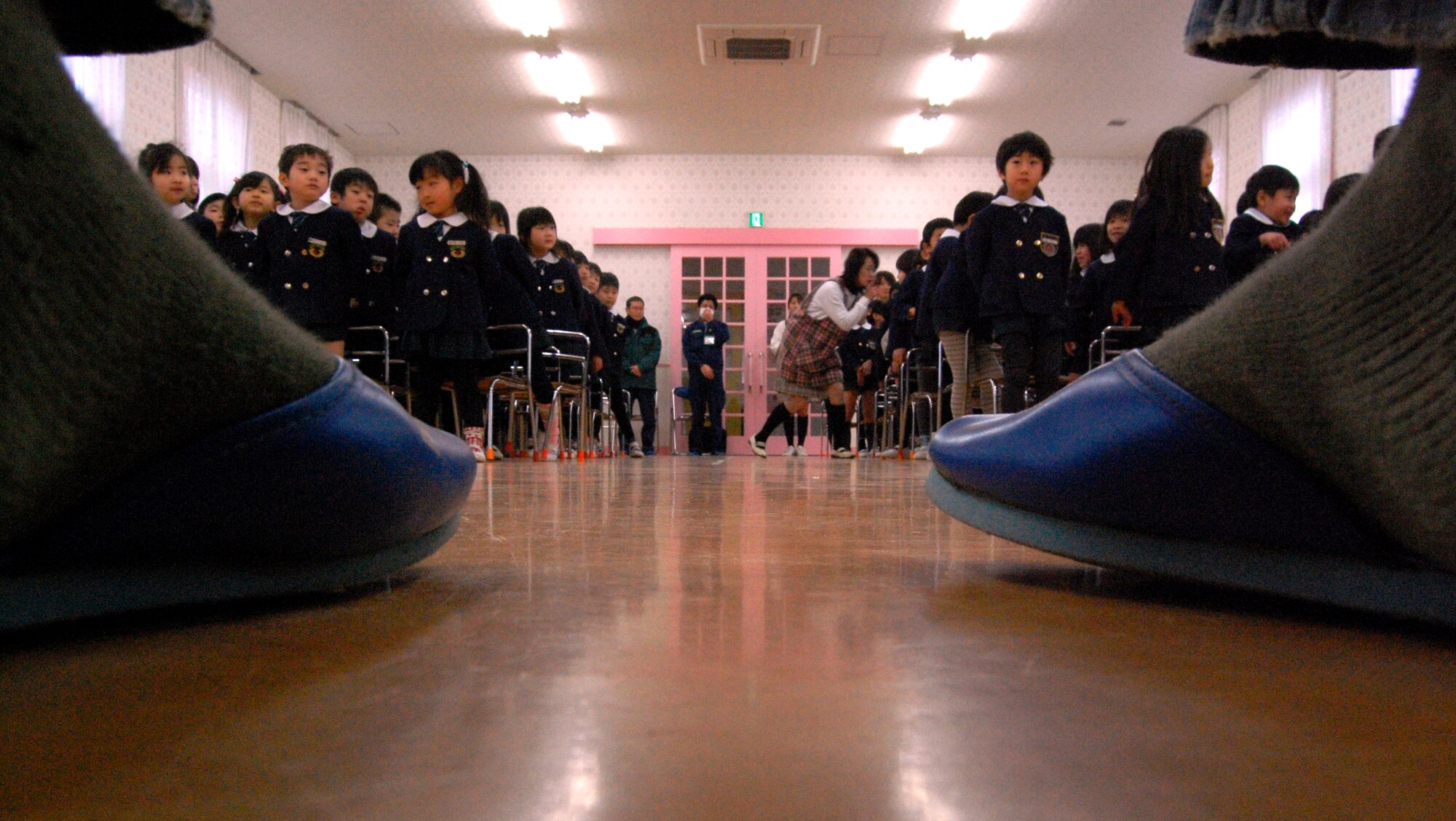 About 100 Kindergartners from Runbini Kindergarten near Hyakuri Air Base greeted a dozen Kadena Airmen during a visit Feb. 1. The visit was part of a community outreach event during the Airmen's aviation training relocation at the Japanese air base. (U.S. Air Force photo / 1st Lt. Bryan Bouchard)