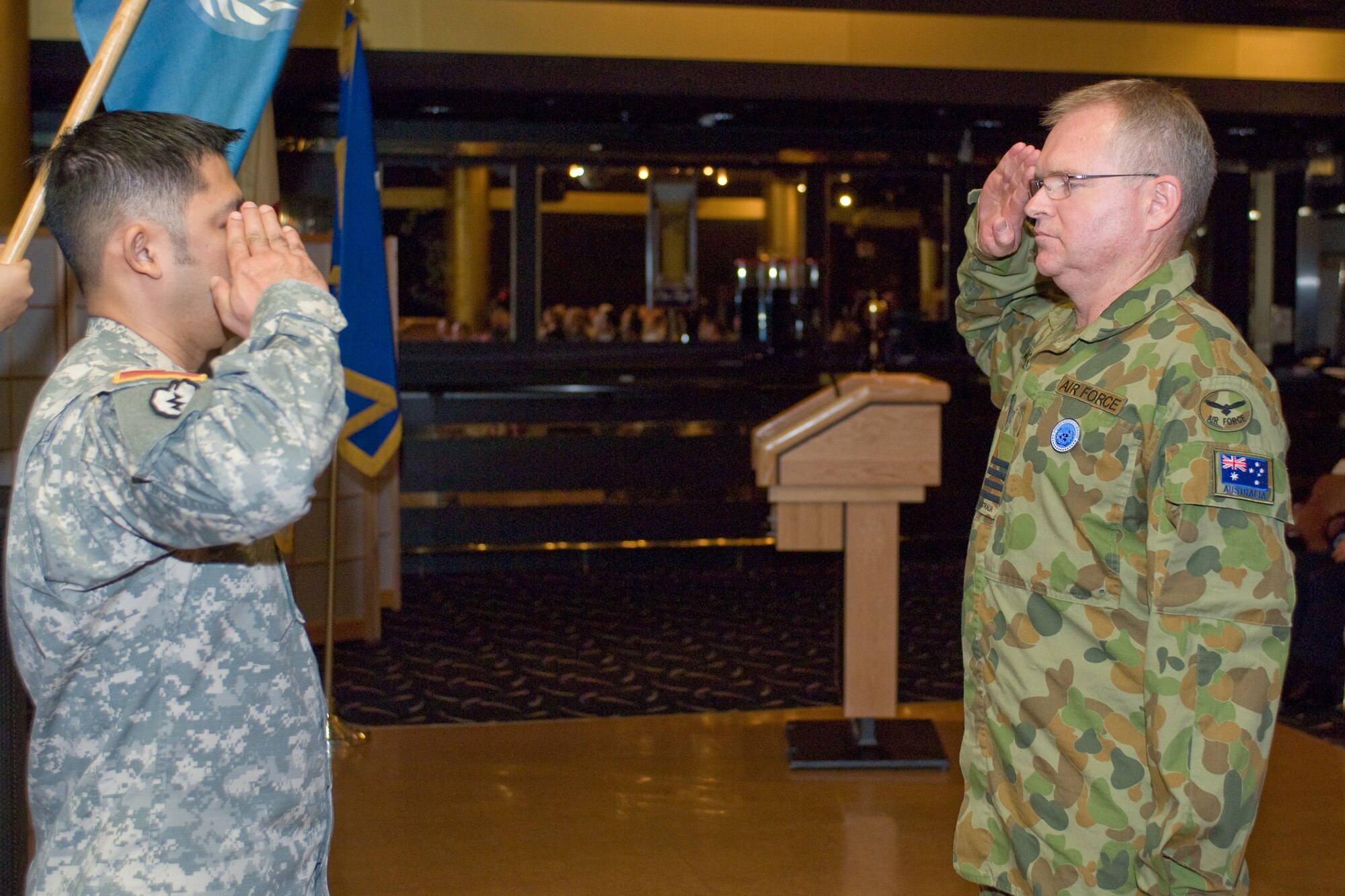 YOKOTA AIR BASE, Japan -- Group Captain Anthony McCormack, incoming United Nations Command (Rear) commander presents the first salute during the change of command ceremony Feb. 01. Group Captain McCormack is from the Royal Australian Air Force and this is the first time in the history of UNC (Rear) that a non-U.S. UN officer assumes command. The UNC (Rear) is composed of eight nations accredited to the United Nations Command: Australia, Canada, France, New Zealand, The Philippines, Thailand, Turkey, and the United Kingdom of Great Britain. The United Nations Command (Rear) has been located at Yokota Air base, Japan since 2007. (U.S. Air Force photo/Osakabe Yasuo)
