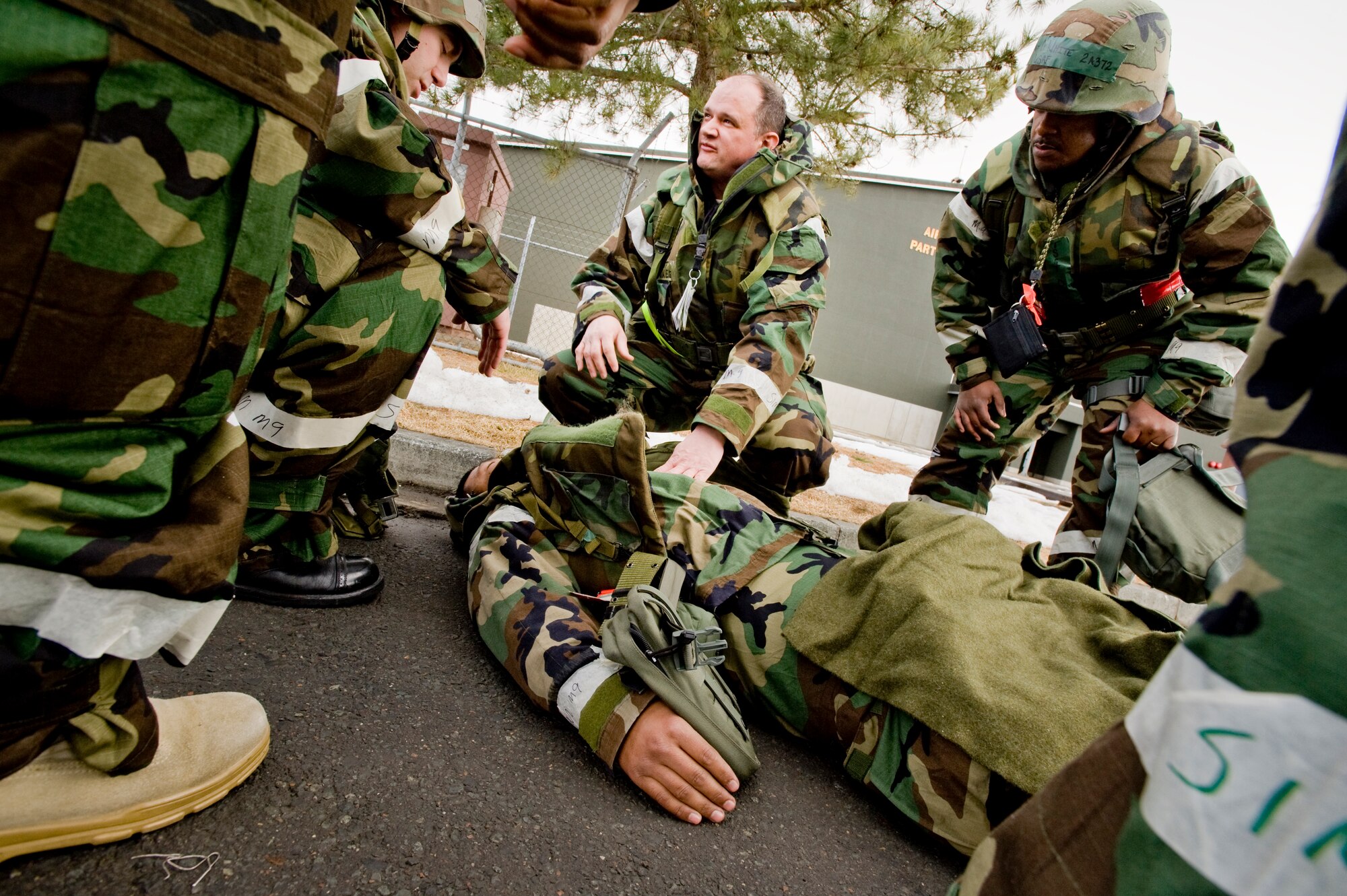 MISAWA AIR BASE, Japan -- Members of the 14th Aircraft Maintenance Unit assess an injured coworker after a simulated emergency occurred on the flightline Feb. 1 during Exercise Beverly Sunrise 10-01. Members of an exercise evaluation team observed and graded the Airmen's performance. (U.S. Air Force photo/Senior Airman Jamal D. Sutter)