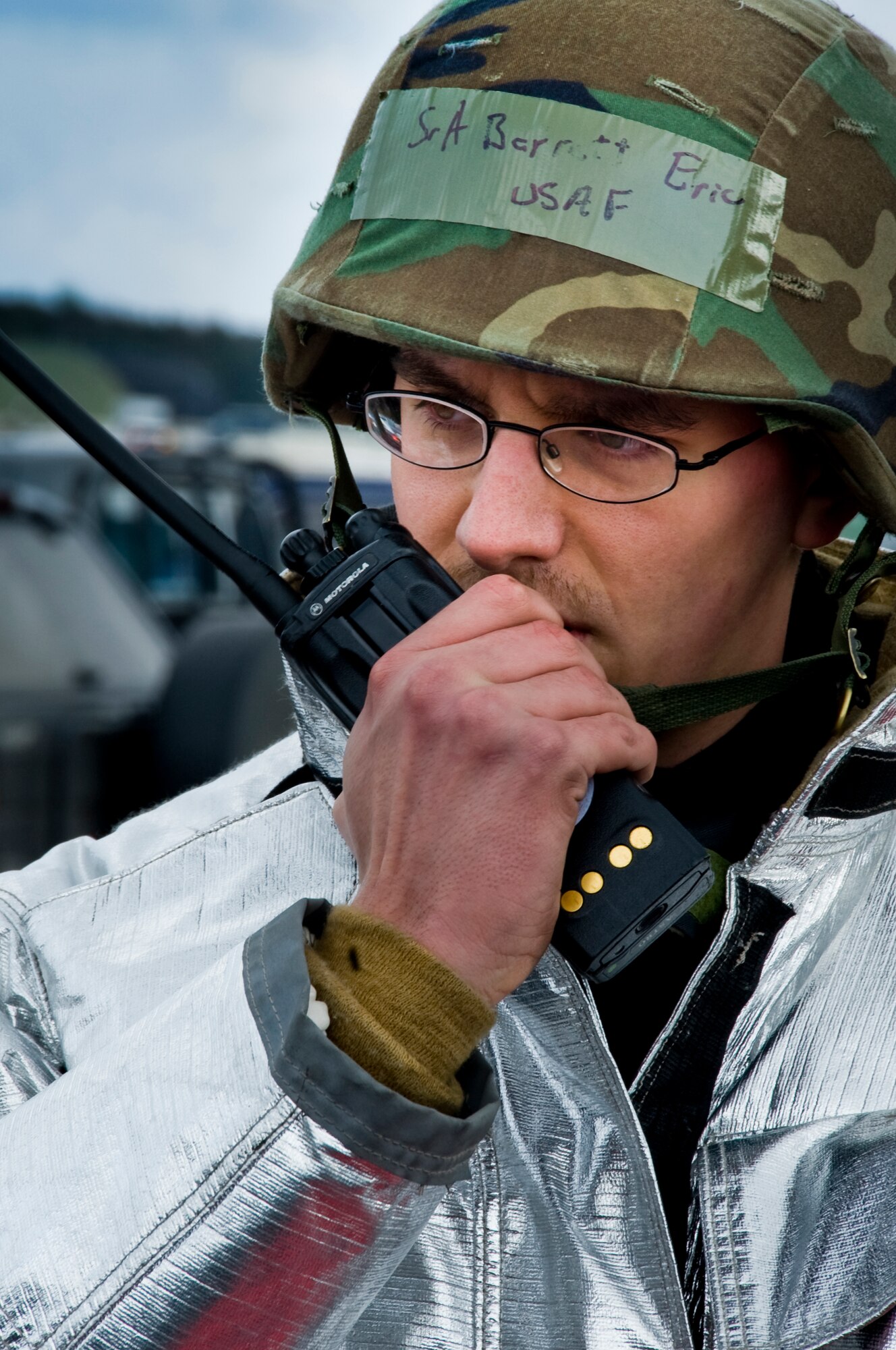 MISAWA AIR BASE, Japan -- Senior Airman Eric Barrett, 35th Civil Engineer Squadron firefighter, assesses a status in response to a simulated emergency on the flightline Feb. 1 during Exercise Beverly Sunrise 10-01. During the scenario, the 35th CES firefighters pulled victims from a simulated blaze before extinguishing it. (U.S. Air Force photo/Senior Airman Jamal D. Sutter)