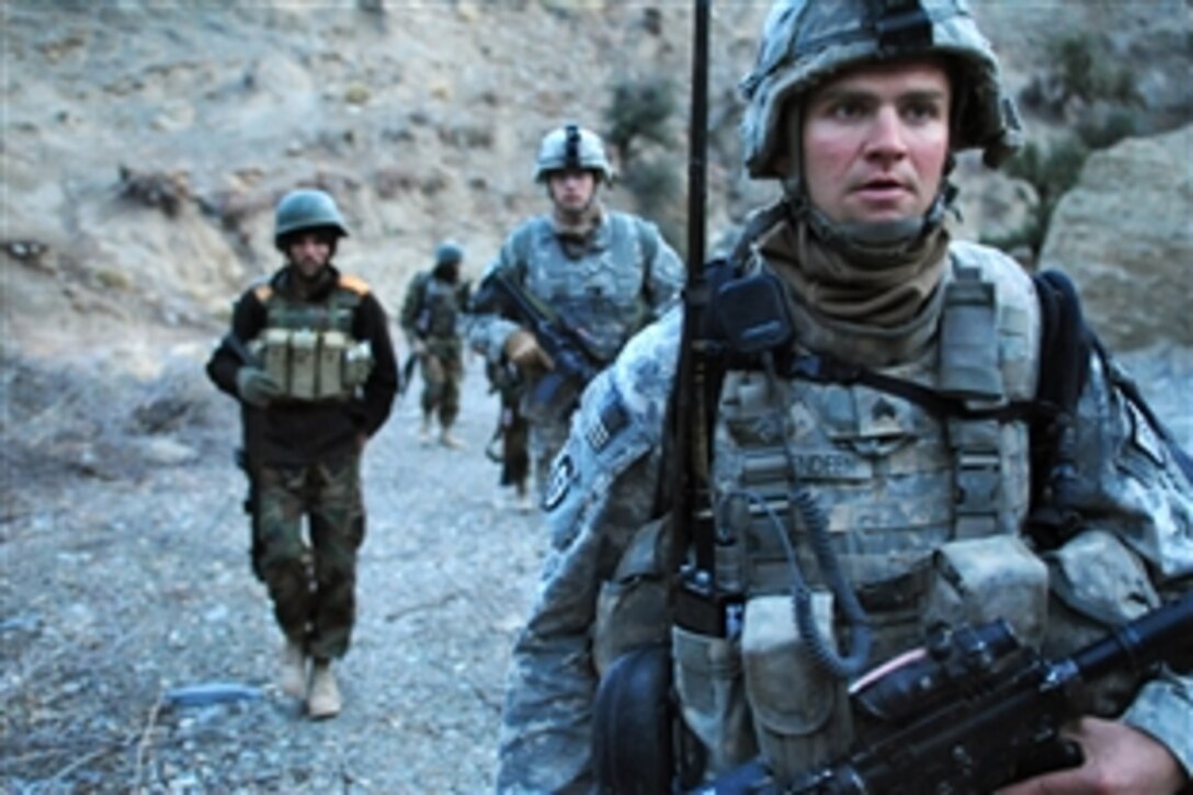 U.S. Army Sgt. Robert Herendeen leads Afghan soldiers while searching multiple caves for weapons during Operation Wawraa Tufaan in Zanbar province, Afghanistan, Jan. 31, 2010. Herendeen is assigned to the 25th Infantry Division's Company D, 1st Battalion, 501st Infantry Regiment, 4th Brigade Combat Team.