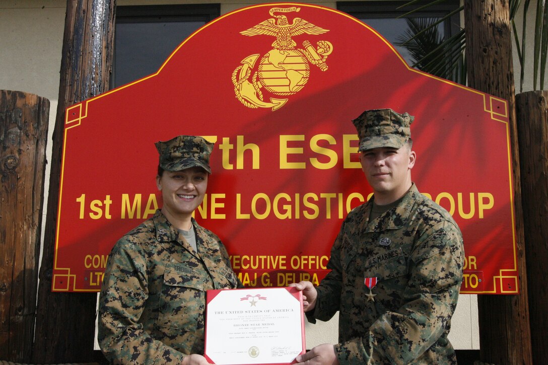 Gunnery Sgt. Erik N. Swanson, explosive ordnance technician teamleader with Explosive Ordnance Disposal Company, 7th Engineer SupportBattalion, 1st Marine Logistics Group, was presented a Bronze Star at Camp Pendleton, Calif., from Capt. Natalie Trogus, company commander, Headquarters Company, 7th ESB, 1st MLG, Feb. 1, for heroic achievements in Afghanistan. Swanson, 30, from Cromwell, Conn., successfully deactivated over 100 improvised explosive devices and disposed of more than 1,000 pounds of munitions while working hand-in-handwith infantry units during his tour.