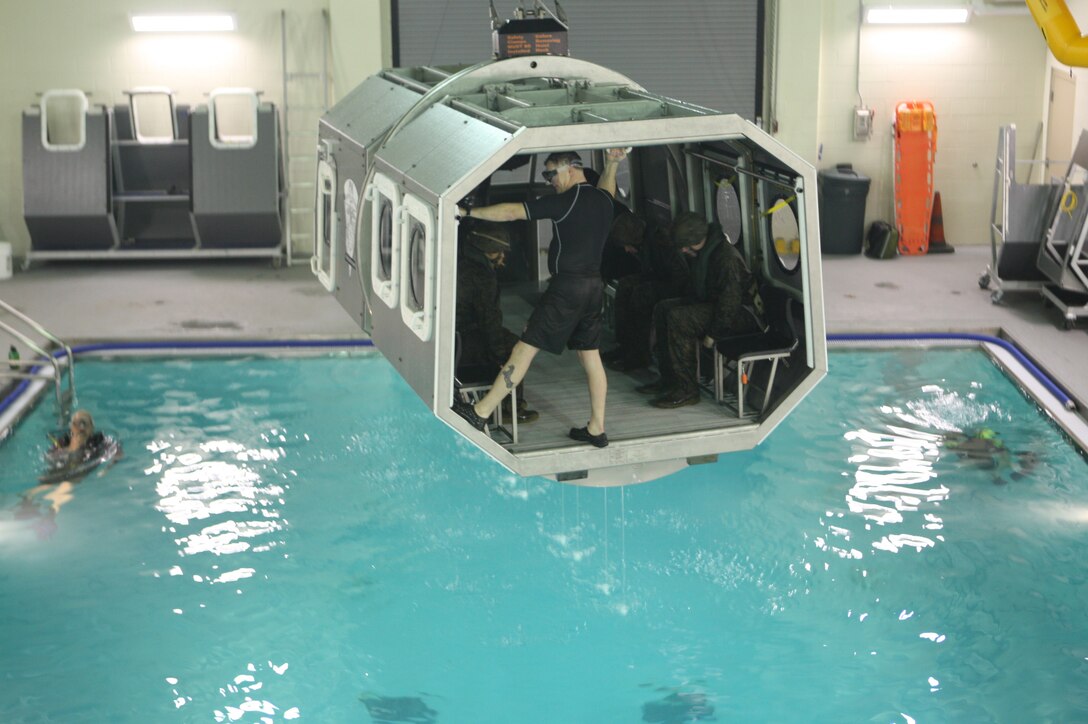 MARINE CORPS BASE CAMP LEJEUNE, N.C. -- Marines and sailors learn how to properly egress from a simulated helicopter during an amphibious crash, Jan. 27. (Marine Corps photo by Lance Cpl. Jonathan G. Wright)