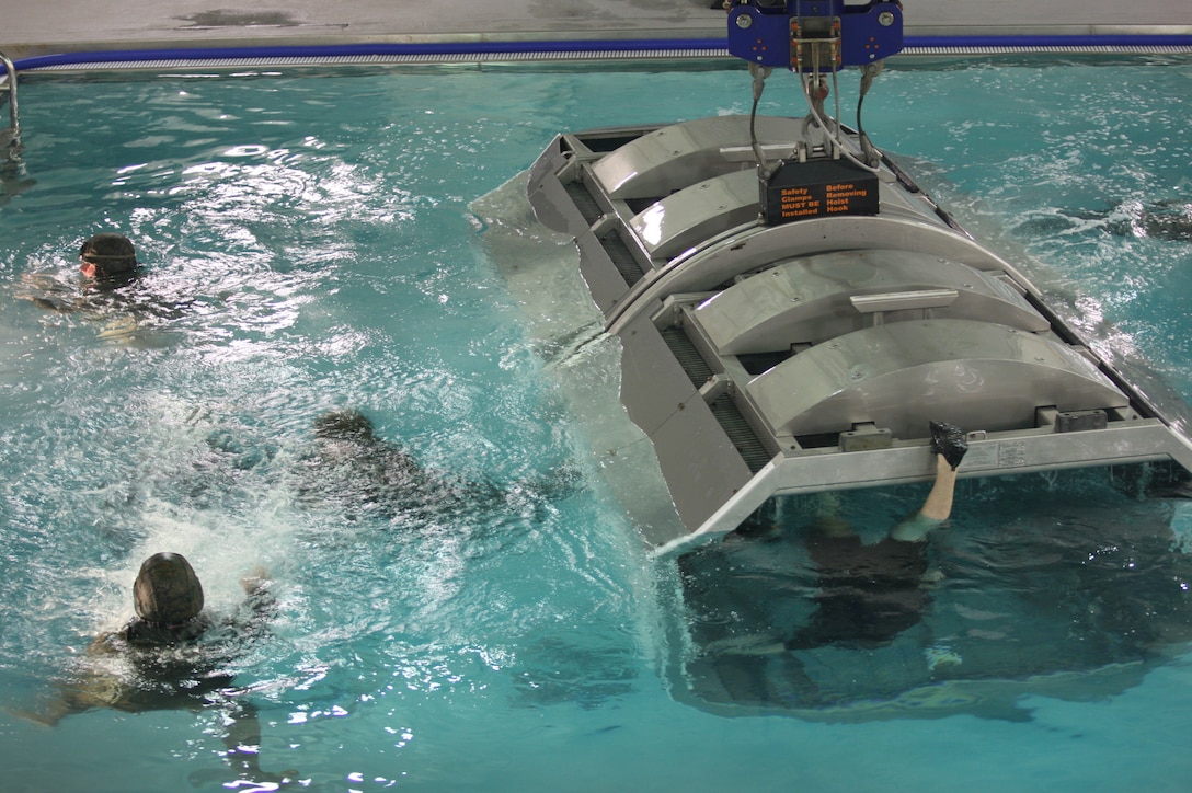 MARINE CORPS BASE CAMP LEJEUNE, N.C. -- Marines and sailors learn how to properly egress from a simulated helicopter during an amphibious crash, Jan. 27. (Marine Corps photo by Lance Cpl. Jonathan G. Wright)