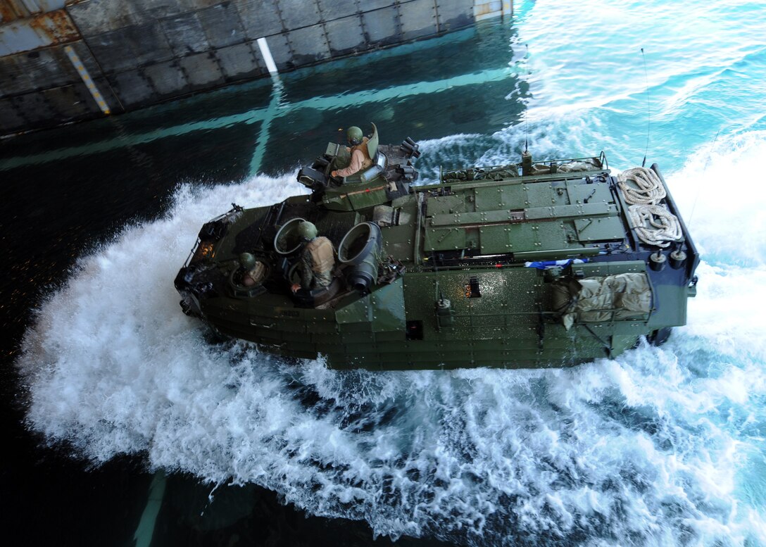Marines assigned to the Marine Air-Ground Task Force for Africa Partnership Station West enter the well deck of USS Gunston Hall aboard an amphibious assault vehicle. The Marines provided humanitarian and relief aid to the Haitian community. Gunston Hall, a Whidbey Island-class dock-landing ship, was originally scheduled for a deployment to Africa in support of APS West, but was diverted to help Haitian relief operations as part of Operation Unified Response. APS West is an international initiative developed by Naval Forces Europe and Naval Forces Africa that aims to improve maritime safety and security in West and Central Africa.