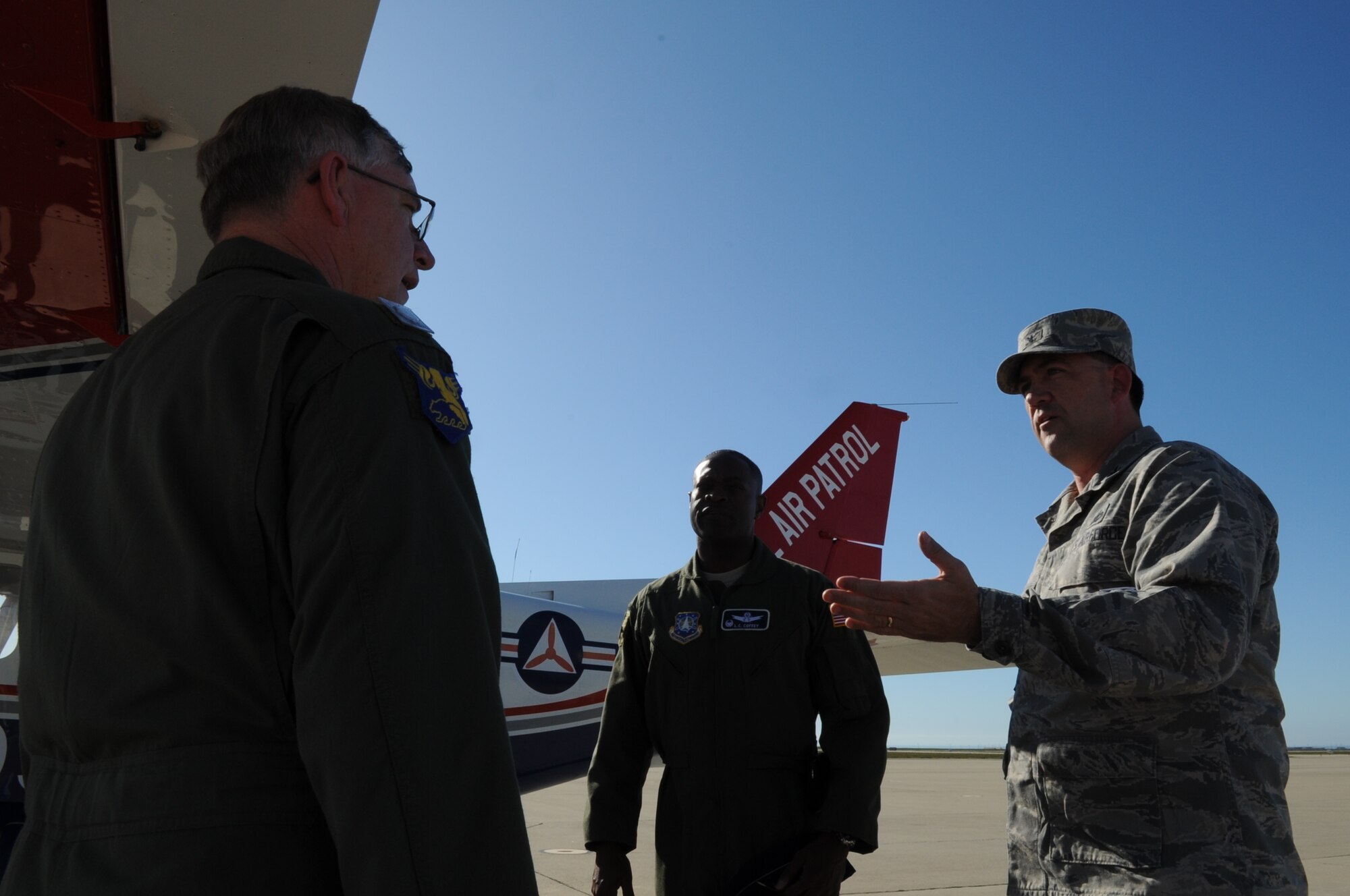 VANDENBERG AIR FORCE BASE, Calif. -- Col. Richard Wright, the 30th Mission Support Group commander, and Col. L.C. Coffey III, the 30th Launch Group commander, discuss details about their flight with retired Lt. Col. Steve Clark, a deputy commander with with the Vandenberg Composite Squadron 101 here Friday, Jan. 29, 2010. The Civil Air Patrol showcased the benefits they can provide to the Vandenberg mission, as well as conducted warm-up training for mission pilots. (U.S. Air Force Photo/Senior Airman Bryan Boyette)