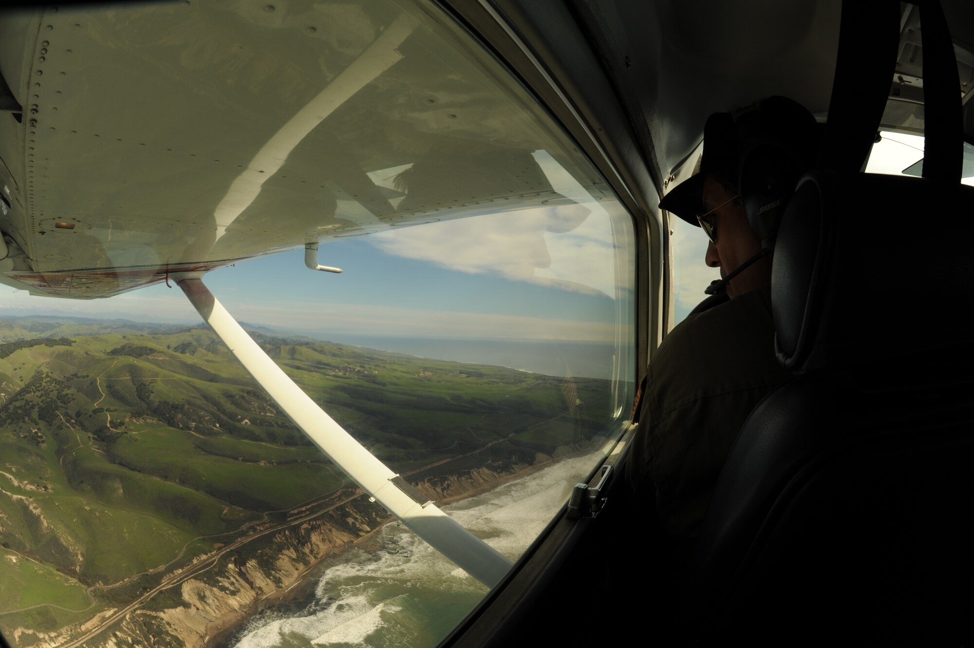 VANDENBERG AIR FORCE BASE, Calif. -- Mr. Tom Stelich, a mission pilot and captain with the Santa Barbara Composite Squadron 131 of the Civil Air Patrol, flies south along the California coast here Friday, Jan. 29, 2010. The Civil Air Patrol showcased the benefits they can provide to the Vandenberg mission, as well as conducted warm-up training for mission pilots. (U.S. Air Force photo/Senior Airman Bryan Boyette)