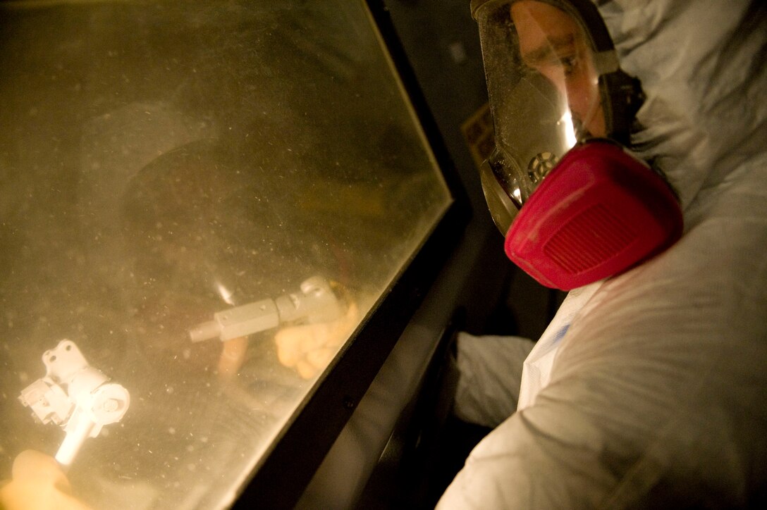 ELLSWORTH AIR FORCE BASE S.D.-- Airman 1st Class Joel Marbury, 28th Maintenance Squadron aircraft structural maintenance apprentice, sprays a B-1B Lancer brake swivel, Feb. 2. The structural maintenance shop has a corrosion prevention program where they sand, blast and paint equipment on a daily basis. (U.S. Air Force photo/Airman 1st Class Corey Hook)