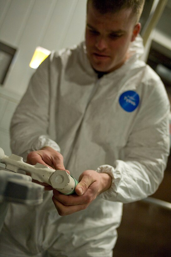 ELLSWORTH AIR FORCE BASE S.D.-- Airman 1st Class Joel Marbury, 28th Maintenance Squadron aircraft structural maintenance apprentice, wraps blast tape on a brake swivel before spraying, Feb. 2. The blast tape is used to prevent the grooves or threads on certain equipment from warping during spraying. (U.S. Air Force photo/Airman 1st Class Corey Hook)