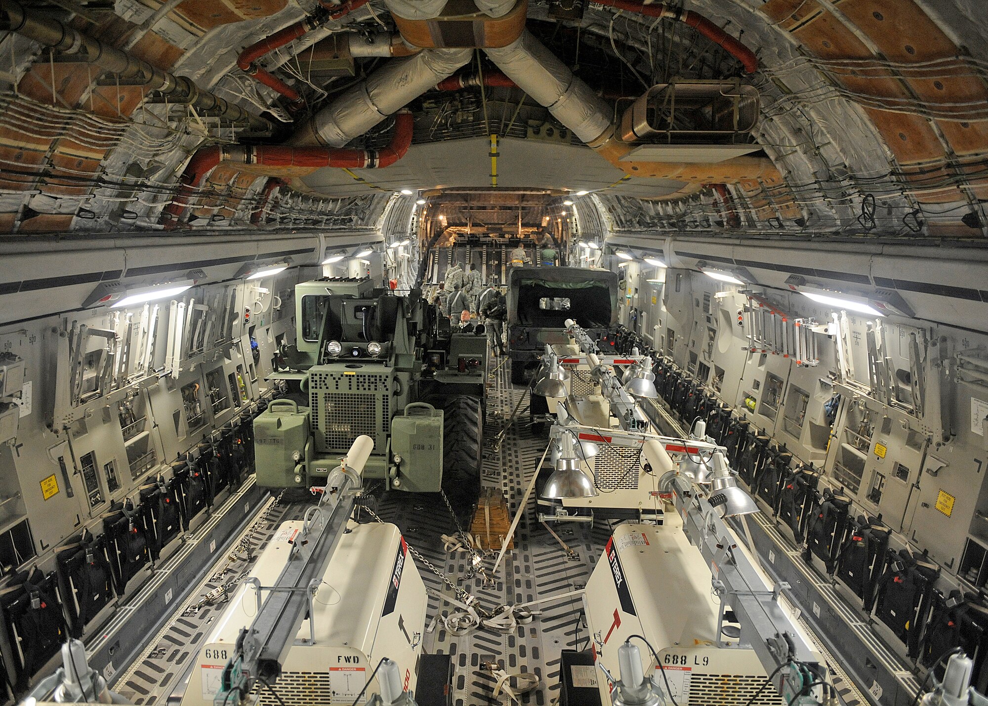 Vehicles, equipment, and supplies are shown loaded into the bay of a C-17 Globemaster III Jan. 22, 2010 at Langley Air Force Base, Va., in support of Operation Unified Response. (U.S. Air Force photo/Airman Rebecca Montez)