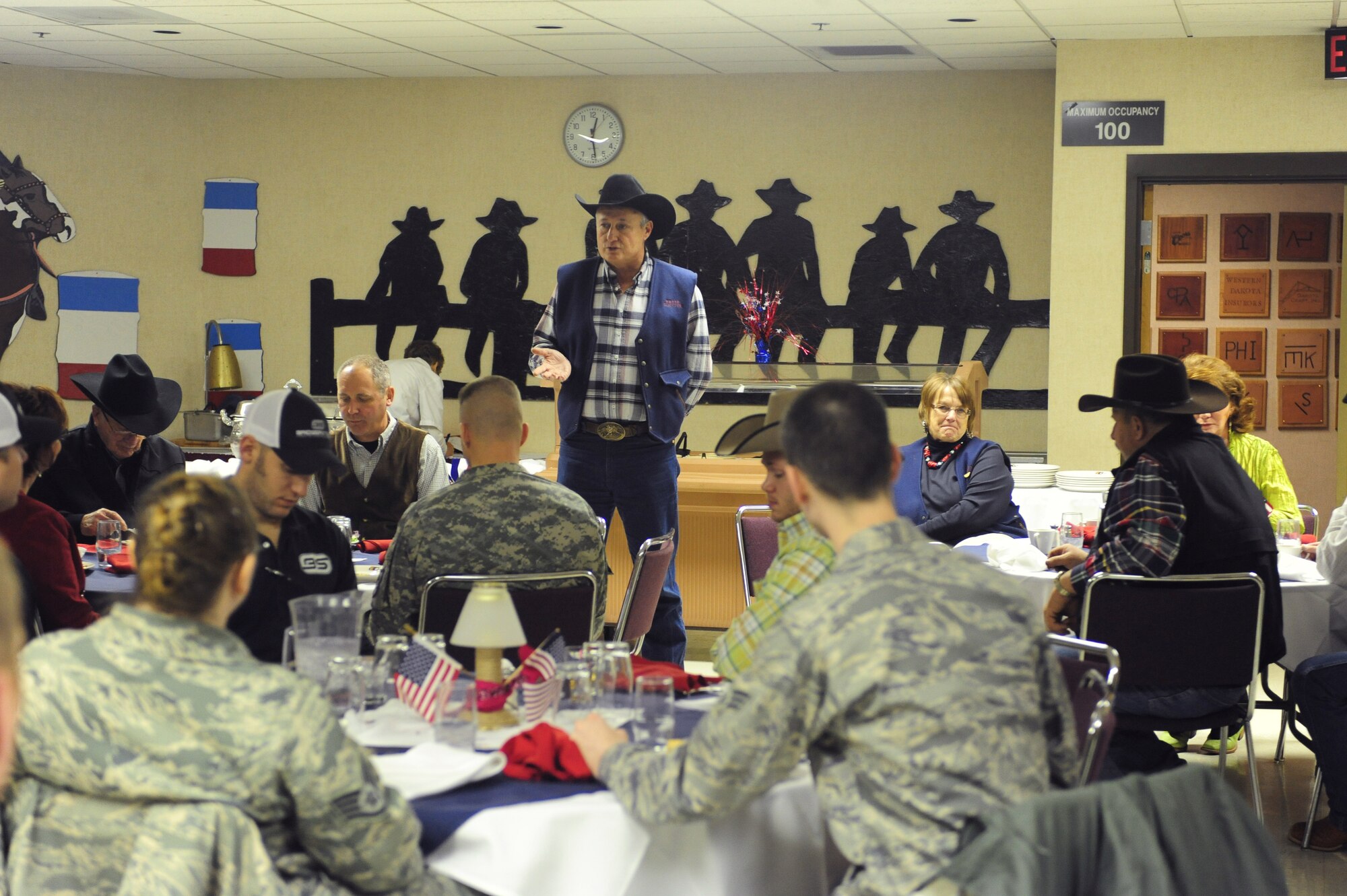 ELLSWORTH AIR FORCE BASE, S.D. -- Lynn Husman, Black Hills Stockshow Foundation president, speaks to Ellsworth Airmen and members of the South Dakota Army National Guard during a military appreciation luncheon, Feb 2.  The Black Hills Stockshow Foundation committee showed their appreciation for the U.S. servicemembers by providing a lunch in their honor. (U.S. Air Force photo/Airman 1st Class Anthony Sanchelli)
