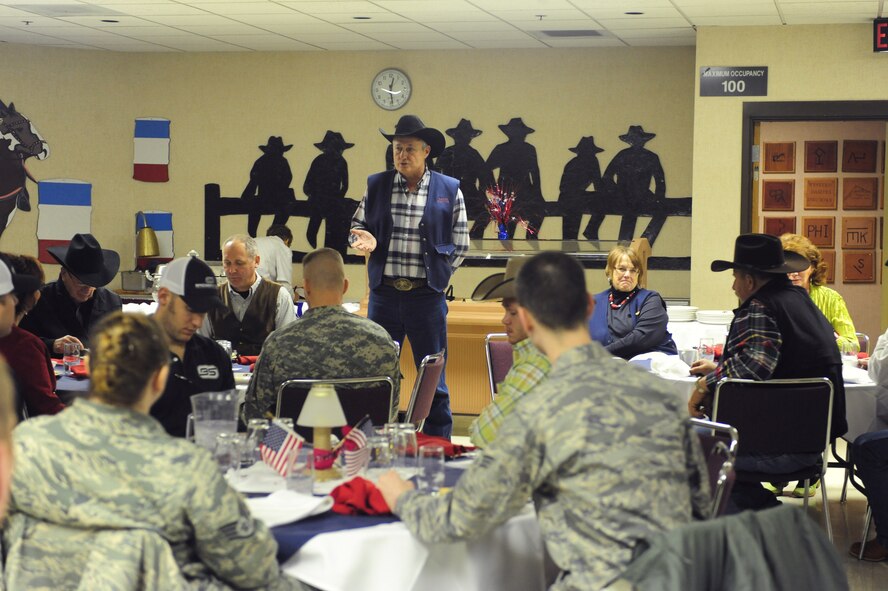 ELLSWORTH AIR FORCE BASE, S.D. -- Lynn Husman, Black Hills Stockshow Foundation president, speaks to Ellsworth Airmen and members of the South Dakota Army National Guard during a military appreciation luncheon, Feb 2.  The Black Hills Stockshow Foundation committee showed their appreciation for the U.S. servicemembers by providing a lunch in their honor. (U.S. Air Force photo/Airman 1st Class Anthony Sanchelli)
