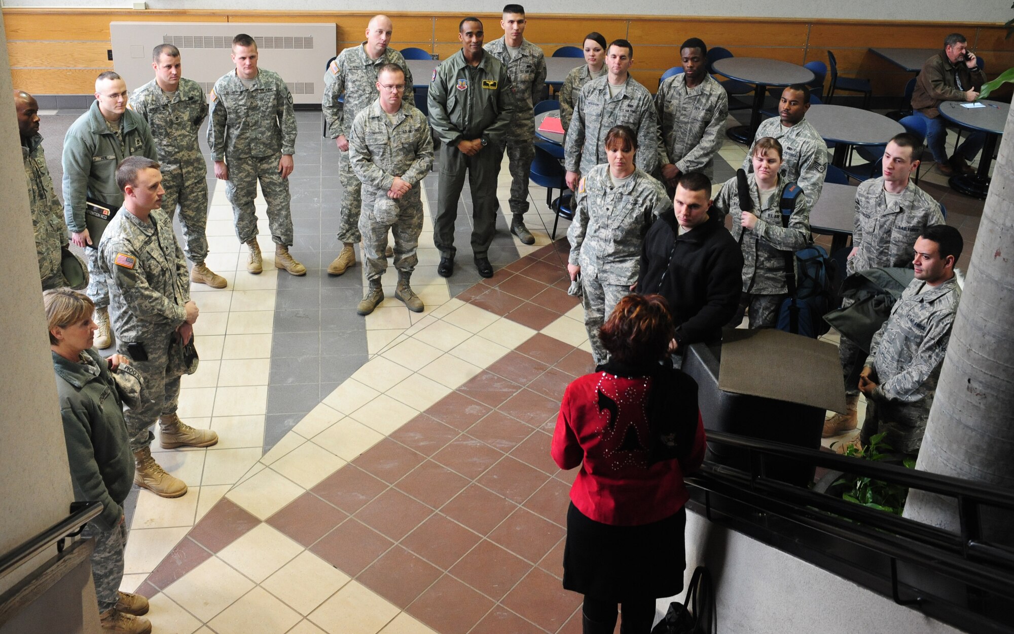 ELLSWORTH AIR FORCE BASE, S.D. -- Ellsworth Airmen and members of the South Dakota Army National Guard, receive instructions from Darla Crown, Black Hills Stockshow committee liaison to the military, before being recognized during a military appreciation luncheon, Feb 2.  The Black Hills Stockshow Foundation committee showed their appreciation for members of the military by providing a lunch in their honor. (U.S. Air Force photo/Airman 1st Class Anthony Sanchelli)