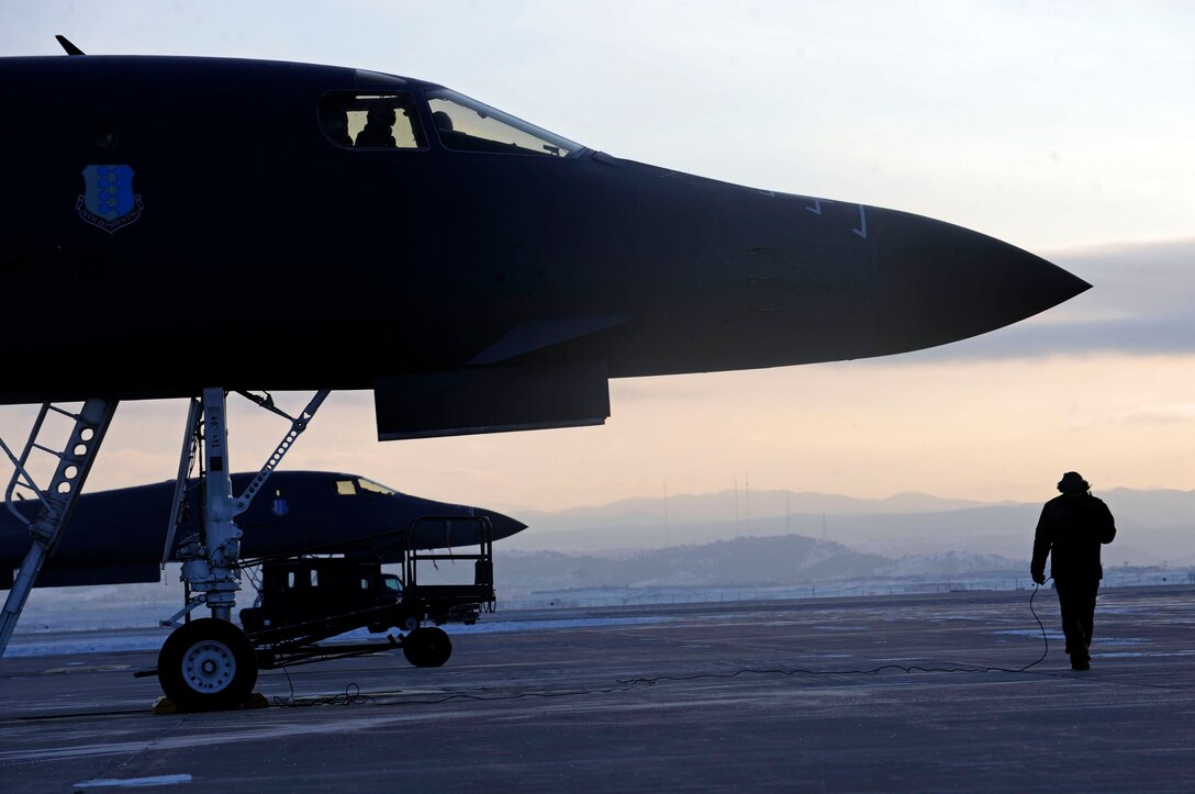 Ellsworth Air Force Base, S.D-- Staff Sgt. Leonardo Riley, 28th Aircraft Maintenance Squadron crew chief, prepares to guide a B-1B Lancer, March 11. The B-1B can rapidly deliver massive quantities of precision and non-precision weapons against any adversary anytime or anyplace. (US Air Force photo/Airman 1st Class Corey Hook)