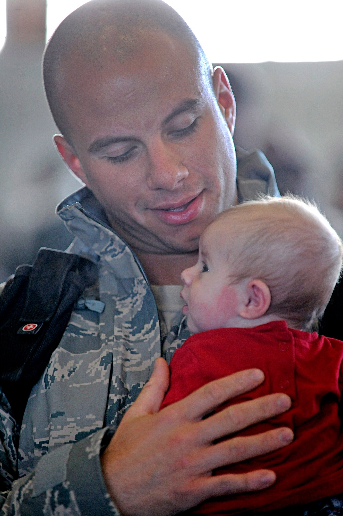 Airman 1st Class Jordan Linial holds his baby for the first time Jan. 27, 2010, at Ellsworth Air Force Base, S.D. Airman Linial met his daughter after returning from his six-month deployment to Southwest Asia. Airman Linial is a 28th Aircraft Maintenance Squadron aircraft armament systems technician. (U.S. Air Force photo/Airman 1st Class Matthew Flynn)

