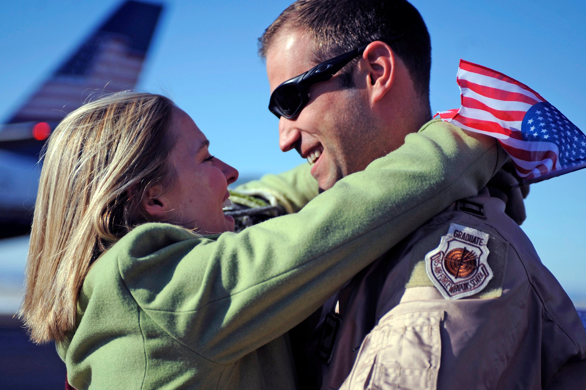 Capt. Jason Corrigan hugs his girlfriend after returning from his deployment to Southwest Asia Jan. 27, 2010, at Ellsworth Air Force Base, S.D. While deployed to Southwest Asia, Captain Corrigan provided support to operations Iraqi Freedom and Enduring Freedom. Captain Corrigan is a 37th Bomb Squadron B-1B Lancer pilot. (U.S. Air Force photo/Airman 1st Class Matthew Flynn)
