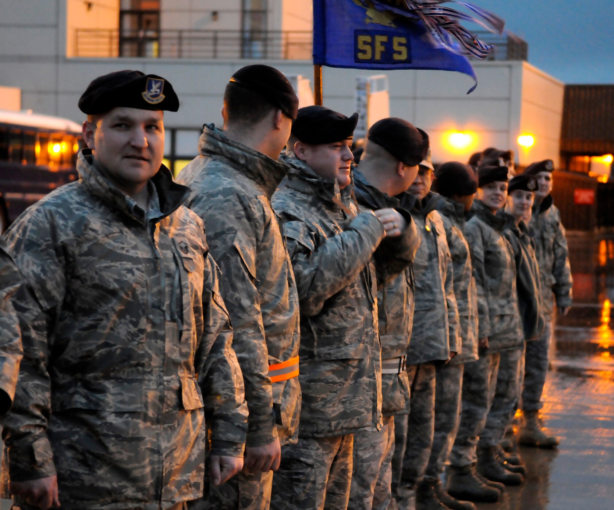 RAF MILDENHALL, England -- Members of the 100th Security Forces Squadron prepare to greet about 150 members of 27 Sqd RAF Regiment, RAF Honington, as they return home from Kandahar Air Base, Afghanistan, Feb. 2.  (U.S. Air Force photo/Staff Sgt. Christopher L. Ingersoll)