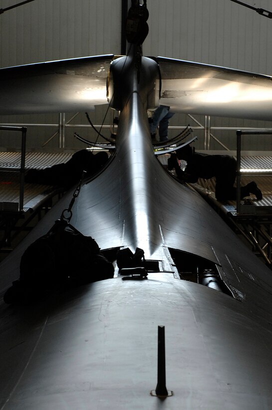 ELLSWORTH AIR FORCE BASE, S.D. -- Members of the 28th Maintenance Squadron perform an isochronal inspection and maintenance on a B-1B Lancer at Ellsworth Air Force Base, S.D., Sept. 17, 2009. During this inspection Airmen look for and repair cracks, chafed wires, worn seals, leaks and other damage to the aircraft. (U.S. Air Force photo/Airman 1st Class Joshua J. Seybert)