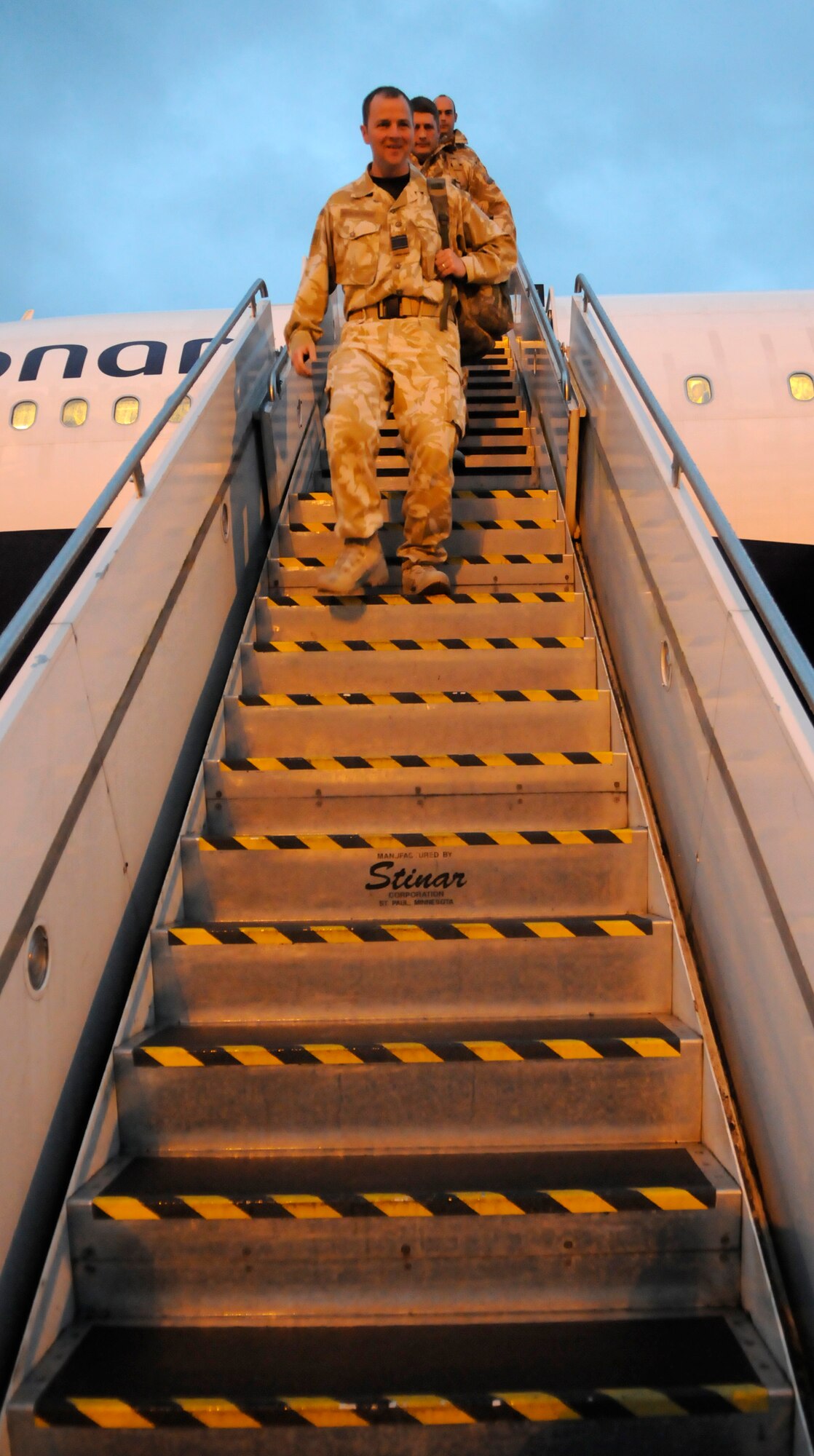 RAF MILDENHALL, England -- Roughly 150 airmen from 27 Sqd RAF Regiment land at RAF Mildenhall Feb. 2, reducing their journey home by about five hours from the usual landing point at RAF Brize Norton.  The Regiment served six months in Afghanistan providing force protection from incoming and outgoing air traffic at Kandahar Air Base.  (U.S. Air Force photo/Staff Sgt. Christopher L. Ingersoll)
