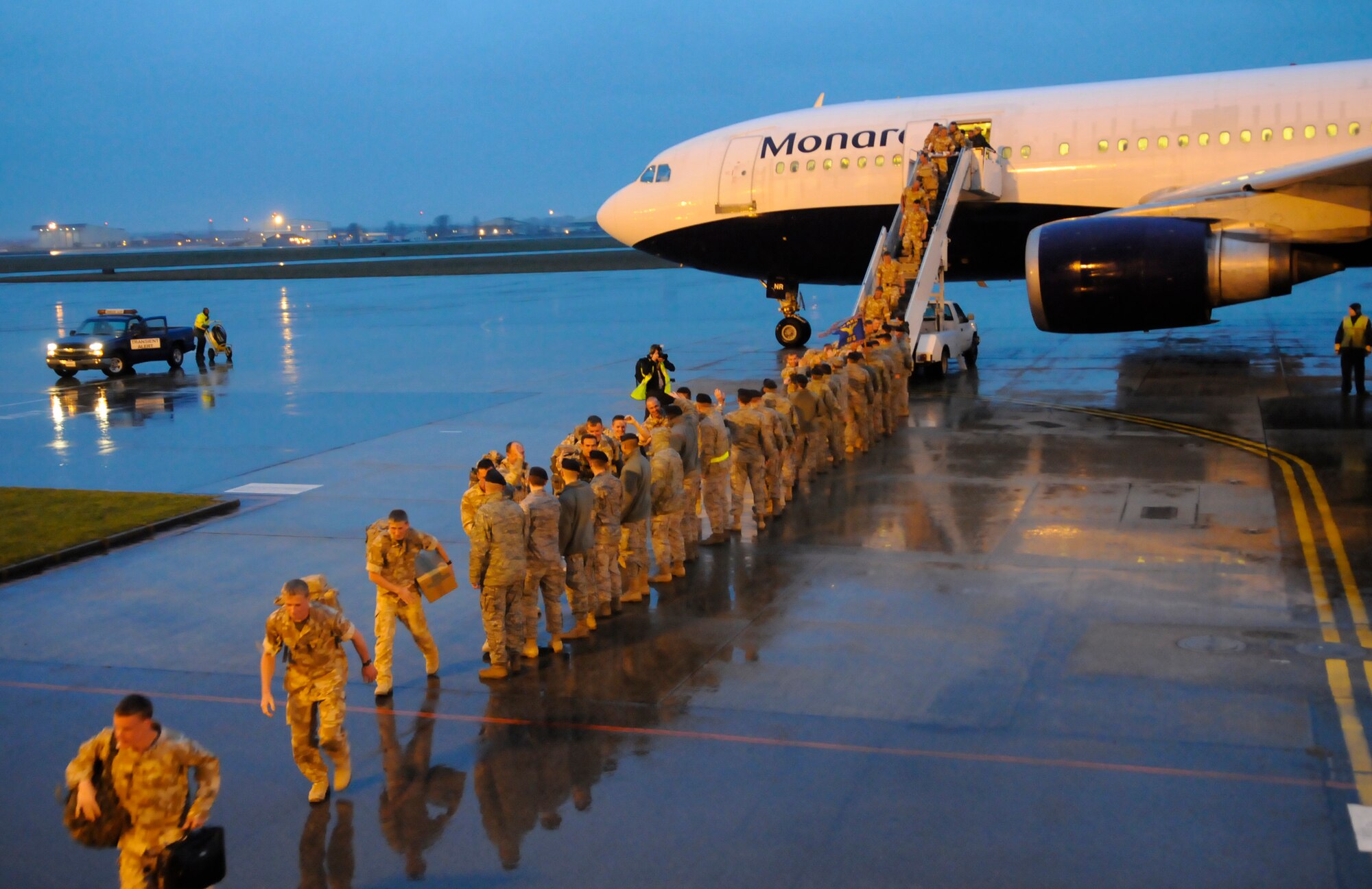 RAF MILDENHALL, England -- Roughly 150 airmen from 27 Sqd RAF Regiment land at RAF Mildenhall Feb. 2 on their way home to RAF Honington after a six-month deployment to Kandahar Air Base, Afghanistan.  The RAF airmen provided force protection for incoming and outgoing flights from insurgent attacks.  (U.S. Air Force photo/Staff Sgt. Christopher L. Ingersoll)