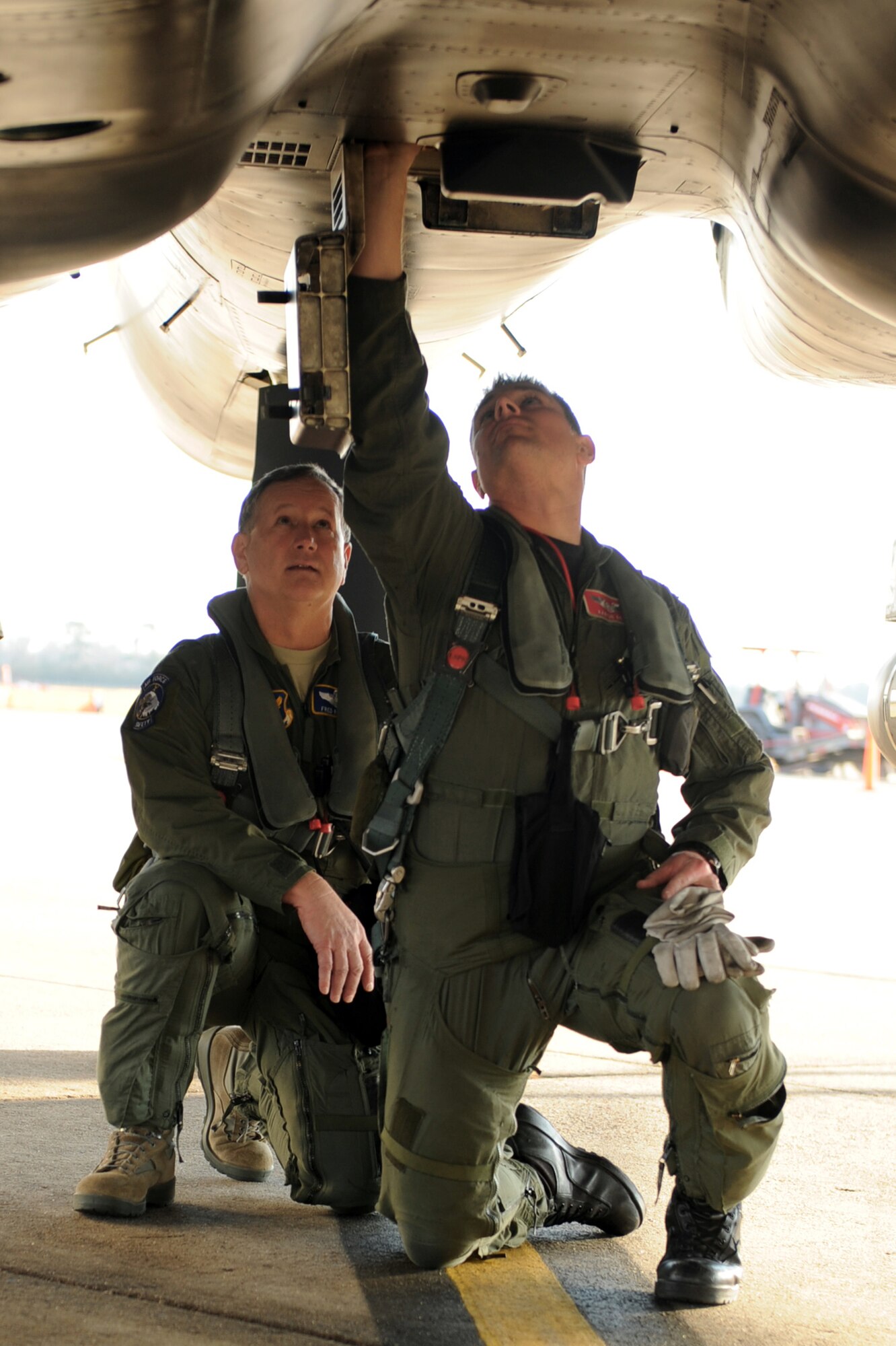 Capt. Aaron Reid explains to Maj. Gen. Frederick F. Roggero what to look for during a preflight inspection Jan. 20, 2010, at Seymour Johnson Air Force Base, N.C. Captain Reid is the 333rd Fighter Squadron chief of weapons, and General Roggero is the Air Force chief of safety. (U.S. Air Force photo/Senior Airman Whitney Lambert)
