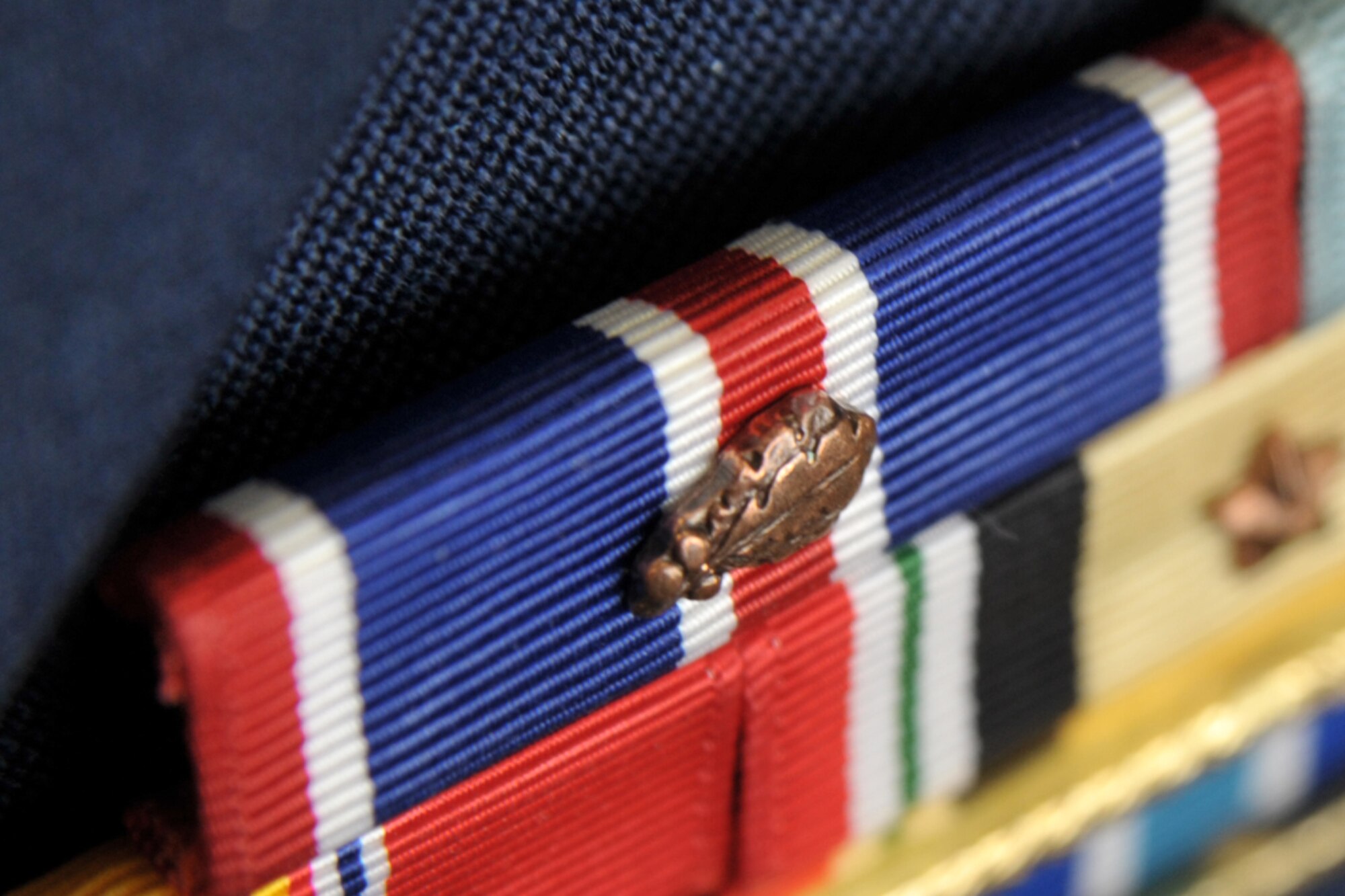 The 931st Air Refueling Group was given the the Air Force Outstanding Unit Award for 2009. The award ribbon has a narrow red stripe, flanked by a thin white stripe, a wide blue stripe, a thin white stripe, edged with a narrow red stripe. (U.S. Air Force photo/Master Sgt. Jason Schaap) 