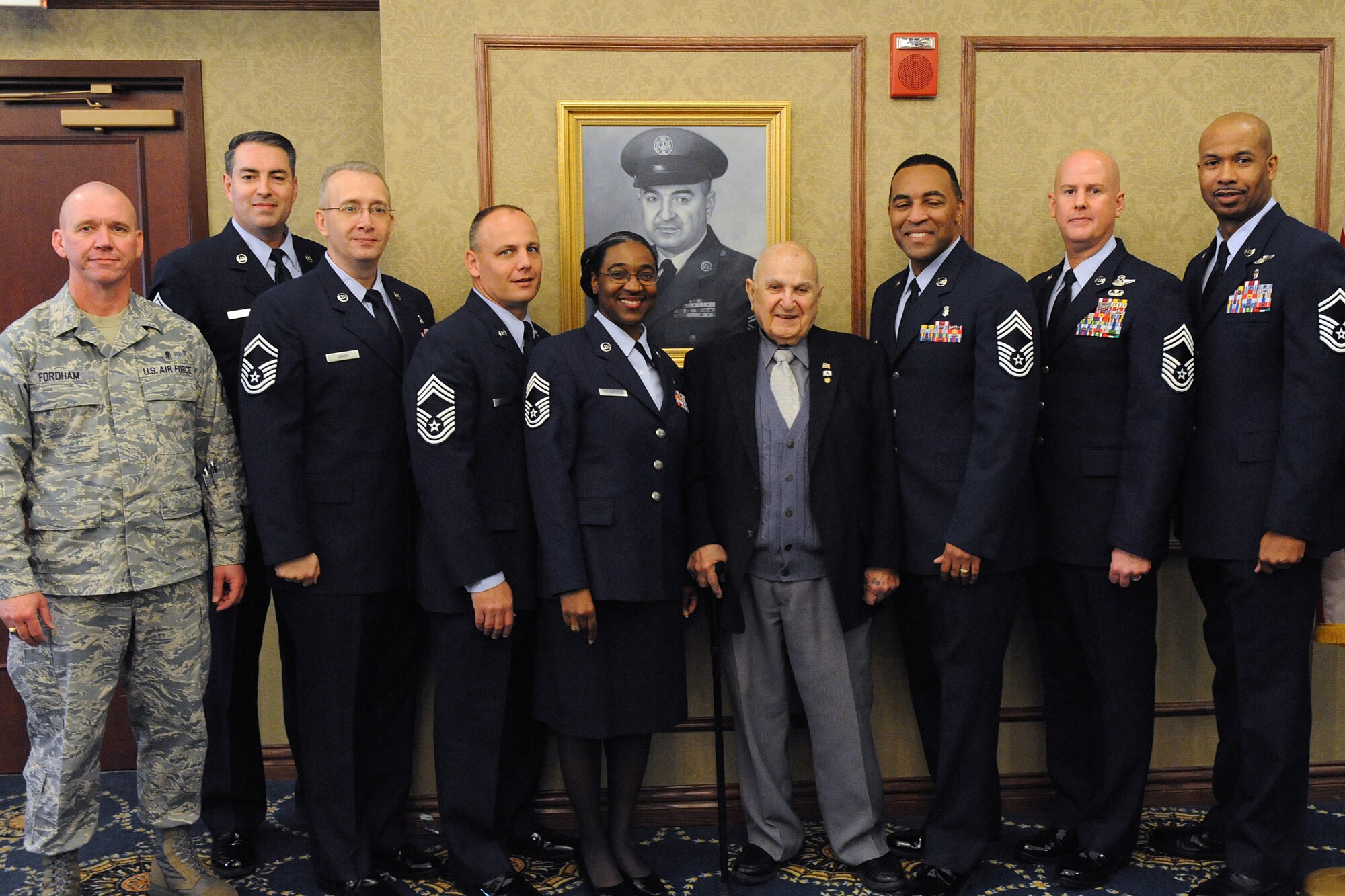 LANGLEY AIR FORCE BASE, Va. -- The Langley Chief's Group poses with retired Chief Master Sgt. Gabriel Christie during the Chief's Room Induction Ceremony Feb. 2.  Chief Christie is one of the first 625 Airmen promoted to chief master sergeant, known as "Charter Chiefs."  (U.S. Air Force photo/Senior Airman Zachary Wolf)
