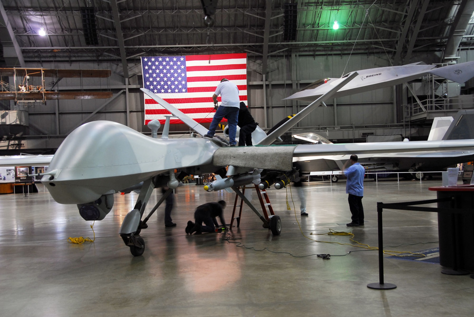 DAYTON, Ohio (01/2010) -- Restoration crews prepare to suspend the YMQ-9 Reaper from the ceiling at the National Museum of the U.S. Air Force. (U.S. Air Force photo)