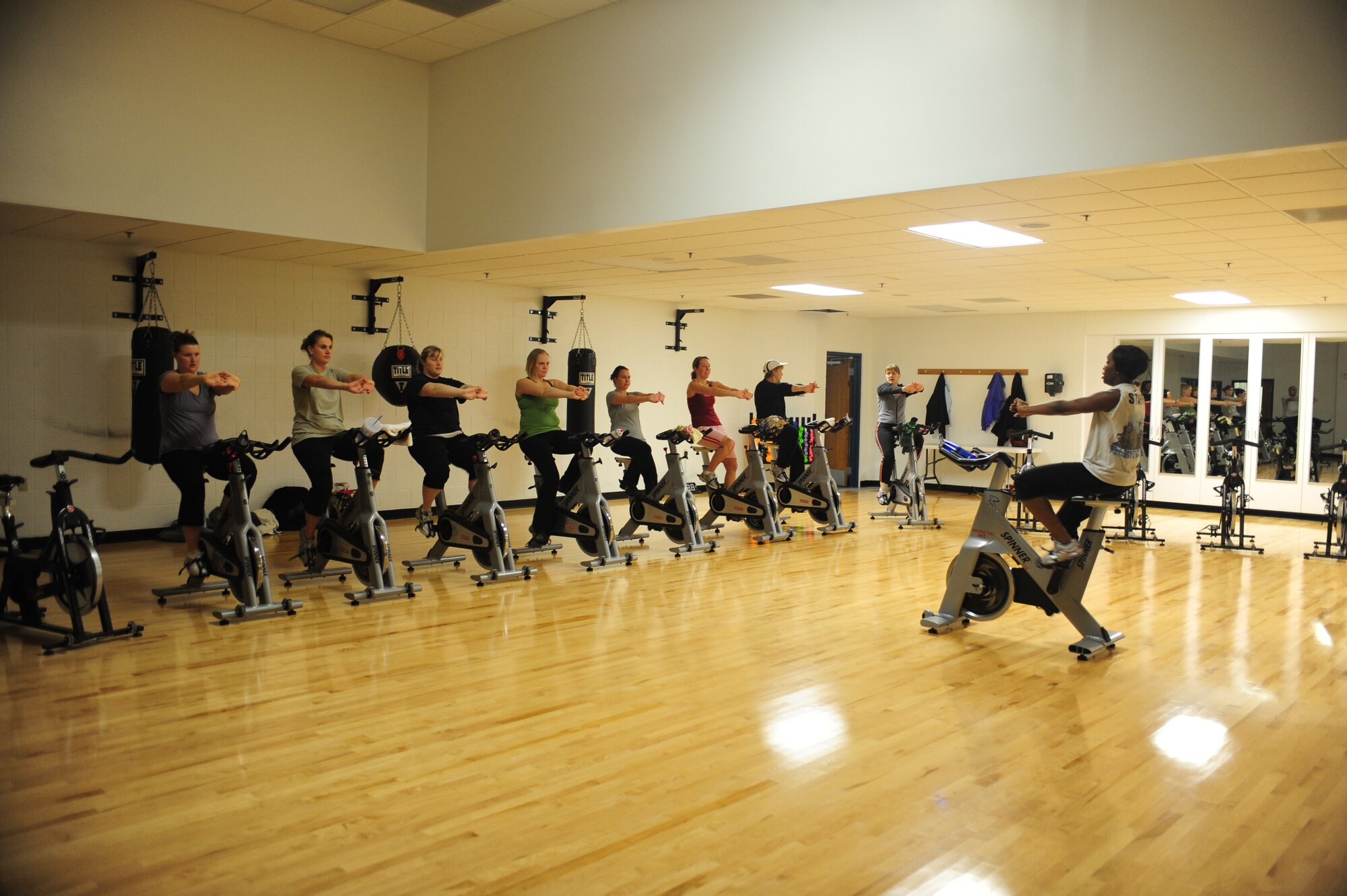 ELLSWORTH AIR FORCE BASE, S.D. -- Wives of deployed Airmen push themselves to the limit during a spin class at the Bellamy Fitness Center, Feb. 2.  The class is part of the "Freedom Miles" program, which is designed to keep spouses active. (U.S. Air Force photo/Airman 1st Class Anthony Sanchelli)


