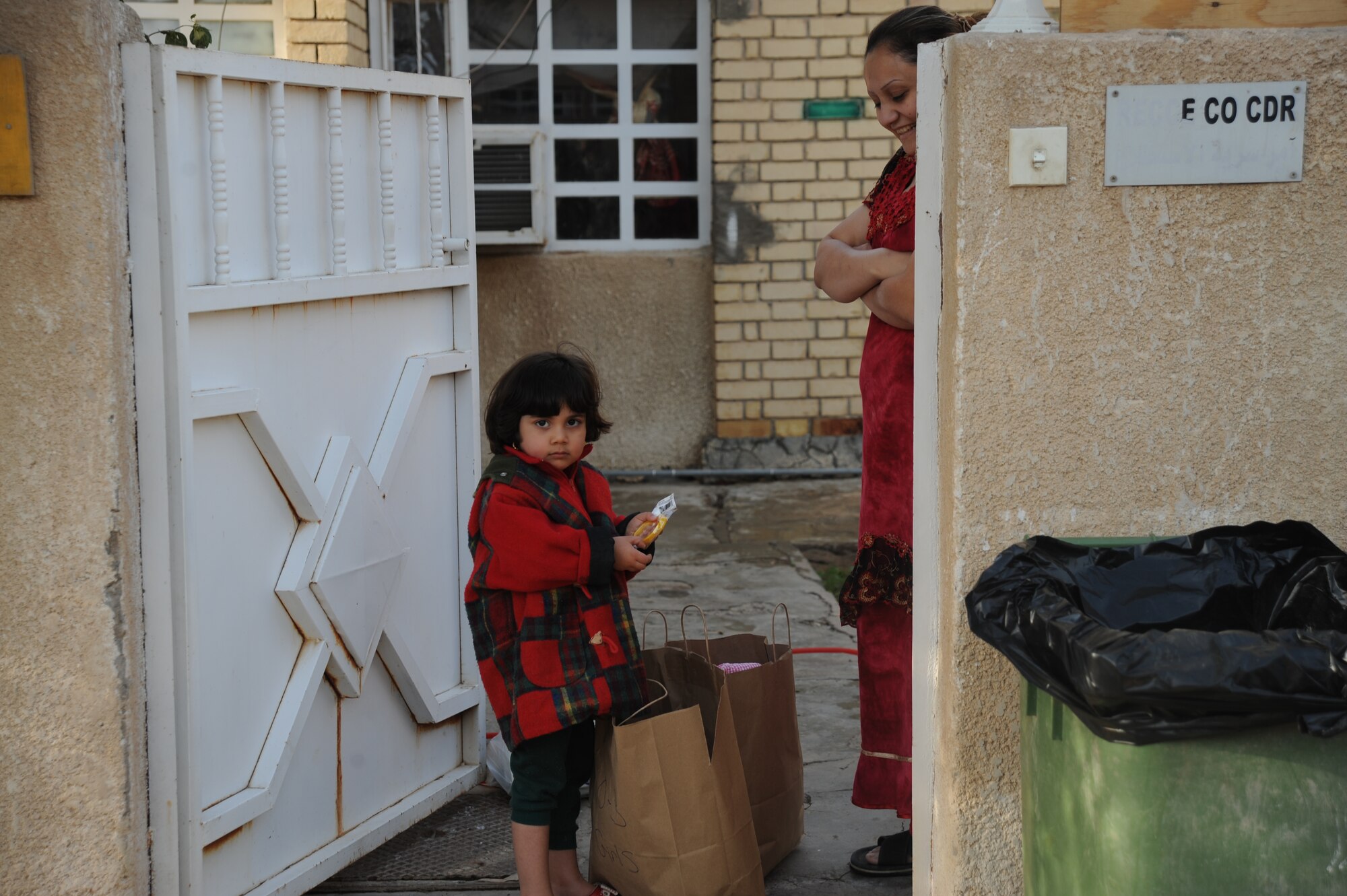 An Iraqi girl pulls out a wristband from a bag donated as part of the Good Neighbor Program Jan. 29, 2010. The GNP collects donated items such as toys, clothes, games and school supplies for distribution throughout the Iraqi community. (U.S. Air Force photo/ Senior Airman Eric Summers Jr/ released)