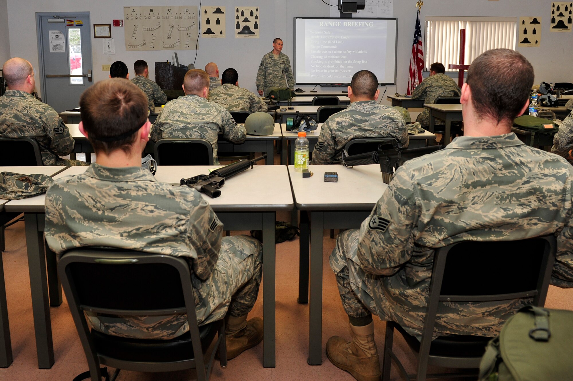 Staff Sgt. Brett Phillips, 19th Security Forces Squadron combat arms instructor, brief students on range safety before going out to the range on base Jan 21. Combat arms training is held at least six times in one month with approximately 21 students in each class. (U.S. Air Force photo by Airman 1st Class Lausanne Pacheco)