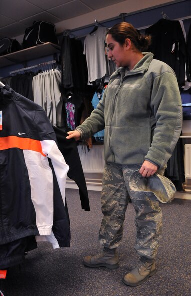 RAF MILDENHALL, England -- Staff Sgt. Barbara Johnson, 100th Force Support Squadron, looks through fitness apparel at the newly opened Athletic Image store Feb. 2.  The store carries name-brand athletic apparel and equipment in a convenoent location between the RAF Mildenhall BXtra and Commissary.  (U.S. Air Force photo by Staff Sgt. Austin M. May)