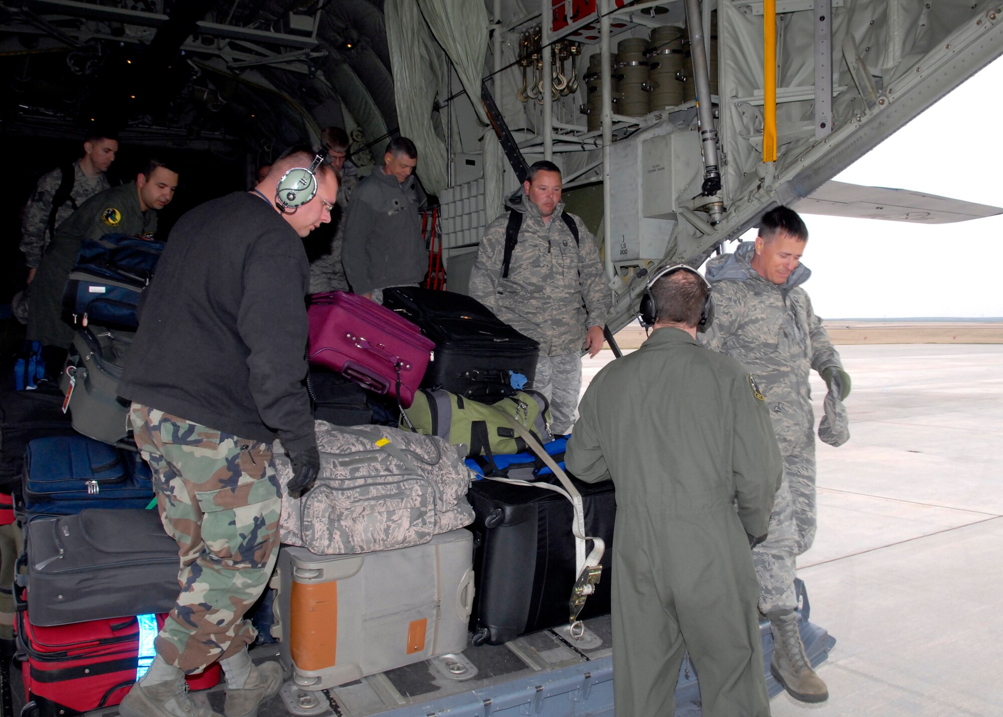 Members of an Air Education and Training Command Inspector General team departs a C-130 Hercules Feb. 1 after arriving for their inspection of the 82nd Training Wing. The team begins its week-long inspection of the wing Feb. 2. (U.S. Air Force photo/Mike Litteken)
