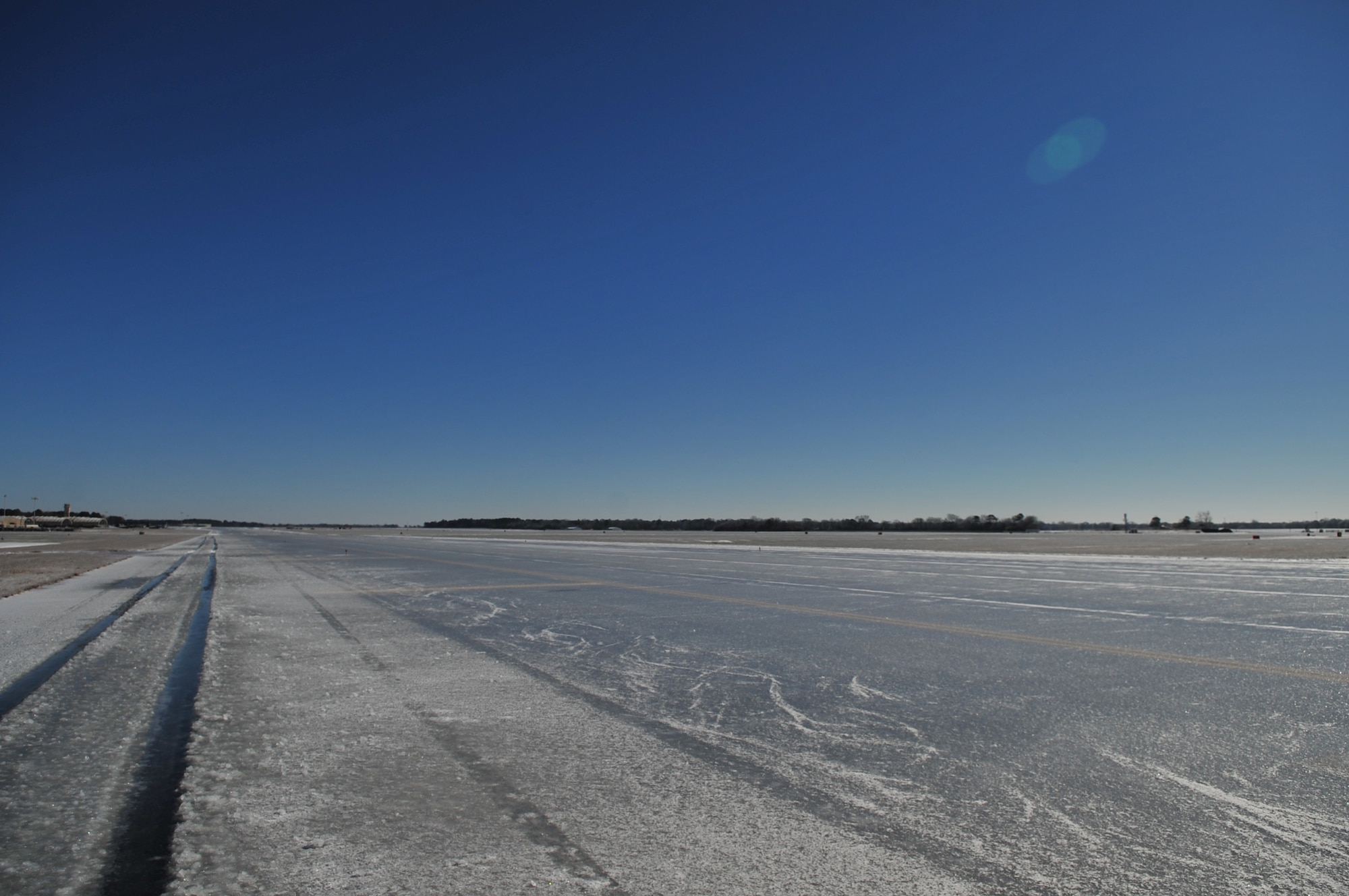 The runway on Seymour Johnson Air Force Base, N.C., is barren land after the area was hit by a winter storm Jan. 30, 2010.  (U.S. Air Force photo/Senior Airman Rae Perry)
