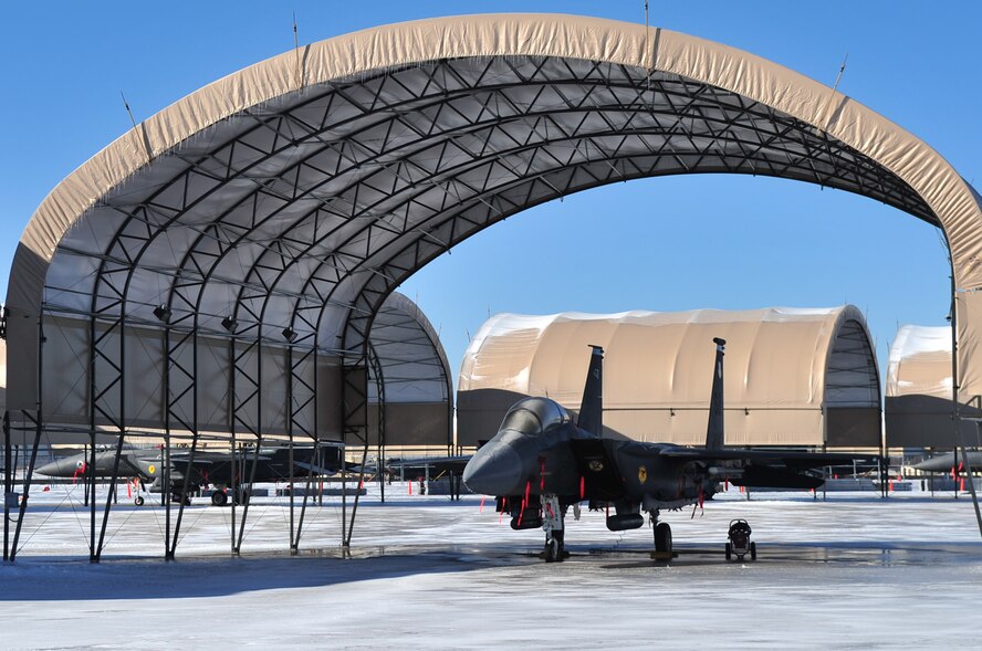 Even though this F-15E Strike Eagle was under an aircraft shelter it was still covered by snow and ice while on the ramp at Seymour Johnson Air Force Base, N.C., Jan. 31, 2010. The storm that came through North Carolina also produced massive amounts of snow in northern Arizona, Texas and Oklahoma while dousing Louisiana, Alabama and Florida with rain. (U.S. Air Force photo/Senior Airman Rae Perry)