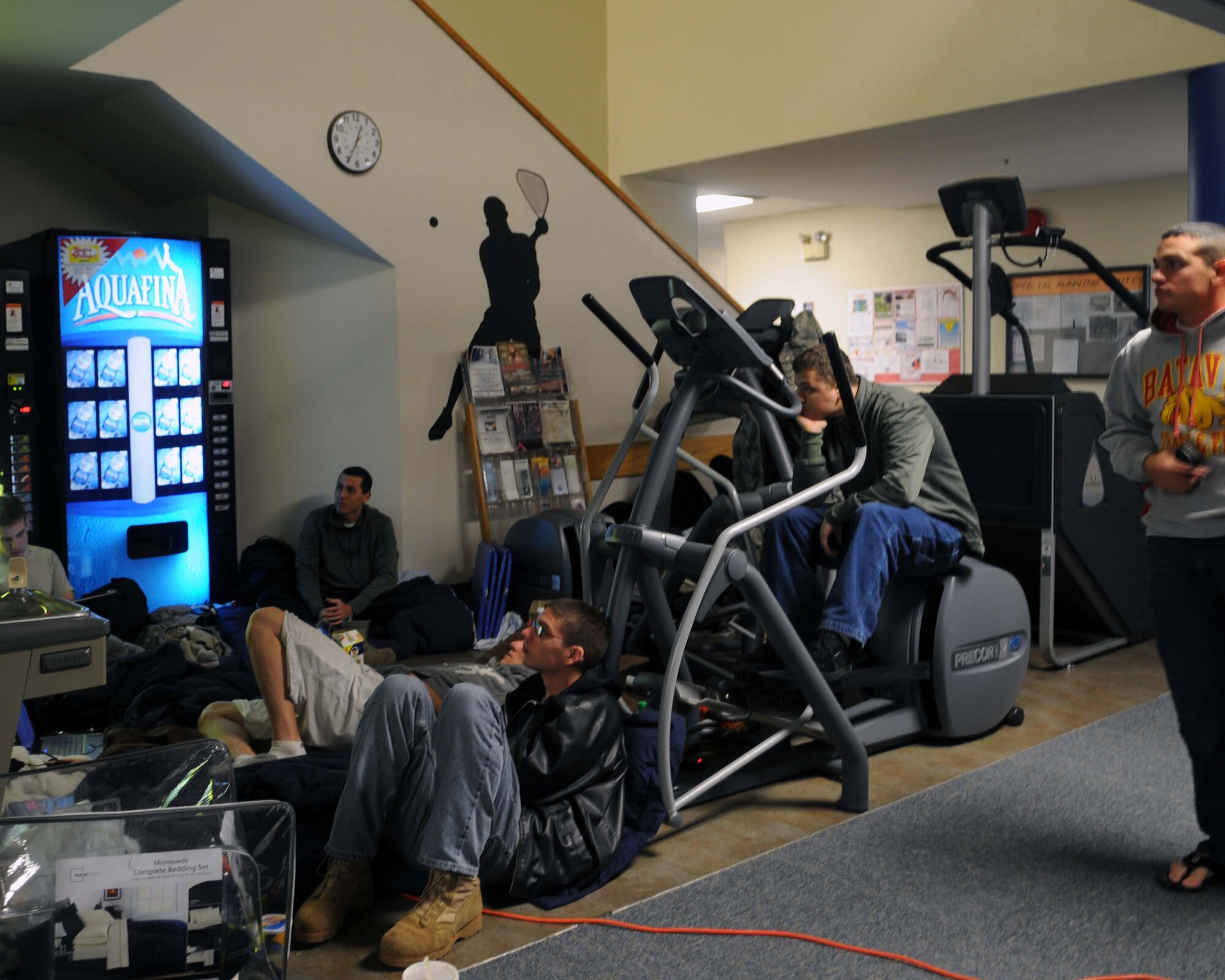 ALTUS AIR FORCE BASE, Okla. -- Altus AFB families take shelter at the Fitness Center Feb. 1. More than 200 Airmen and their families have taken shelter at the Fitness Center and the Medical Clinic during the power outage, which was cause by an ice storm Jan. 28. The Fitness Center, Medical Clinic and Solar Inn Dining facilities were designated as shelter locations. The shelters are being powered by generators to sustain a hospitable environment during the power outage. (U.S. Air Force photo/Senior Airman Leandra D. Hernandez)