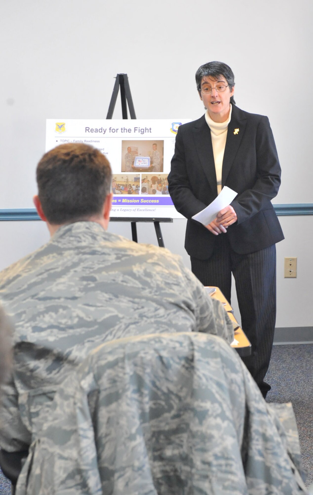 Laura Coseglia, 512th Airlift Wing Airman and Family Readiness, briefs Col. Stephen Clark, Installation Excellence Selection Board member, about AF&R programs here Feb. 1. (U.S. Air Force photo/Jason Minto)