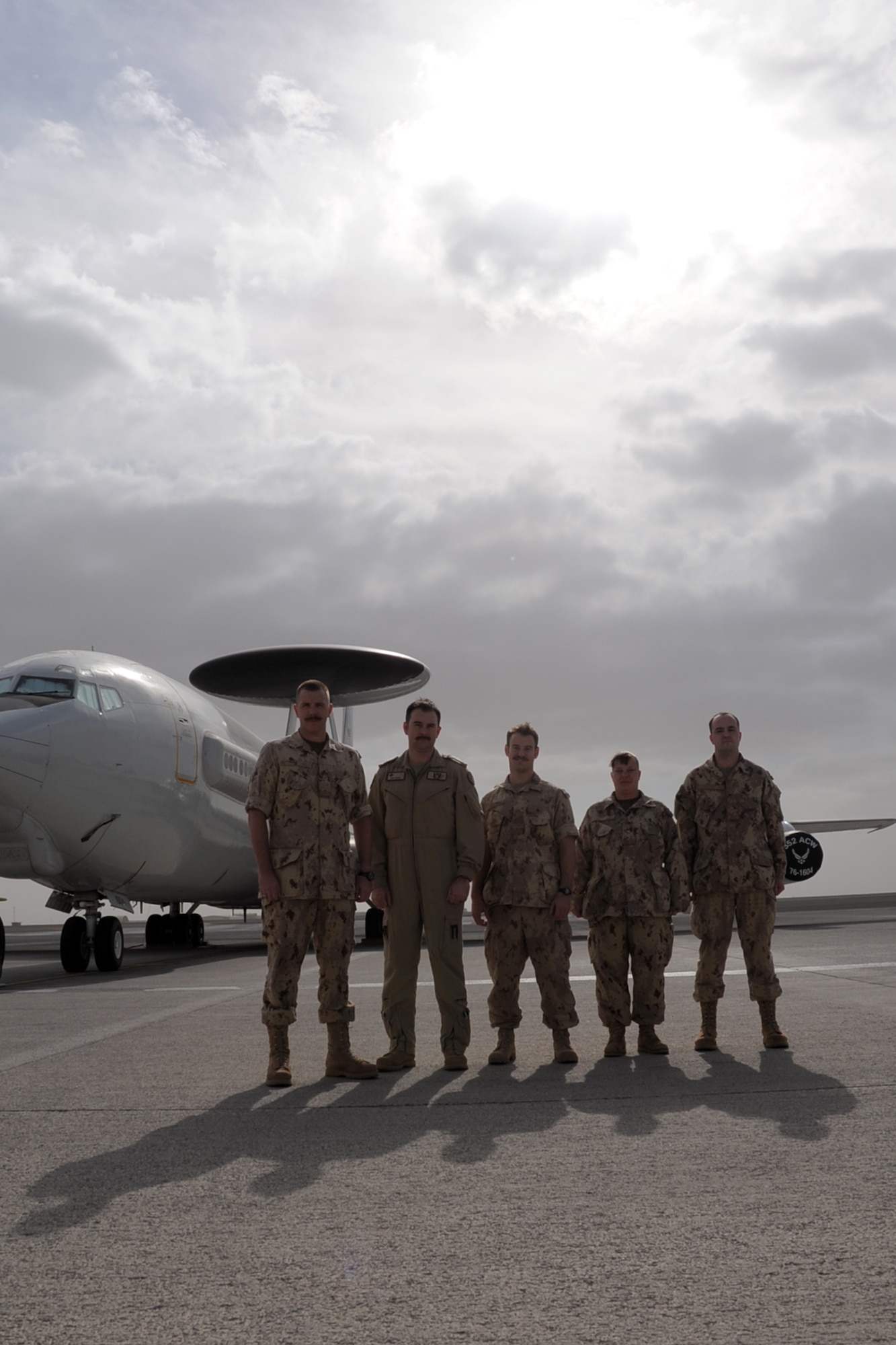 (From left) Maj. Scott Marshall, Capt. Chris Horner, Lt. Will Natynczyk, Sgt. Theresa McLaren, and Master Cpl. Mark Keown, all Canadian Forces members deployed with the 965th Expeditionary Airborne Air Control Squadron, stand at their squadron headquarters at a non-disclosed base in Southwest Asia on Jan. 28, 2010.  The five Canadian Airmen are a part of a crew on an E-3 Sentry Airborne Warning and Control System aircraft deployed from Tinker Air Force Base, Okla. The are a part of the 965th EAACS as part of North American Aerospace Defense Command agreement between the United States and Canada.  (U.S. Air Force Photo/Master Sgt. Scott T. Sturkol/Released)