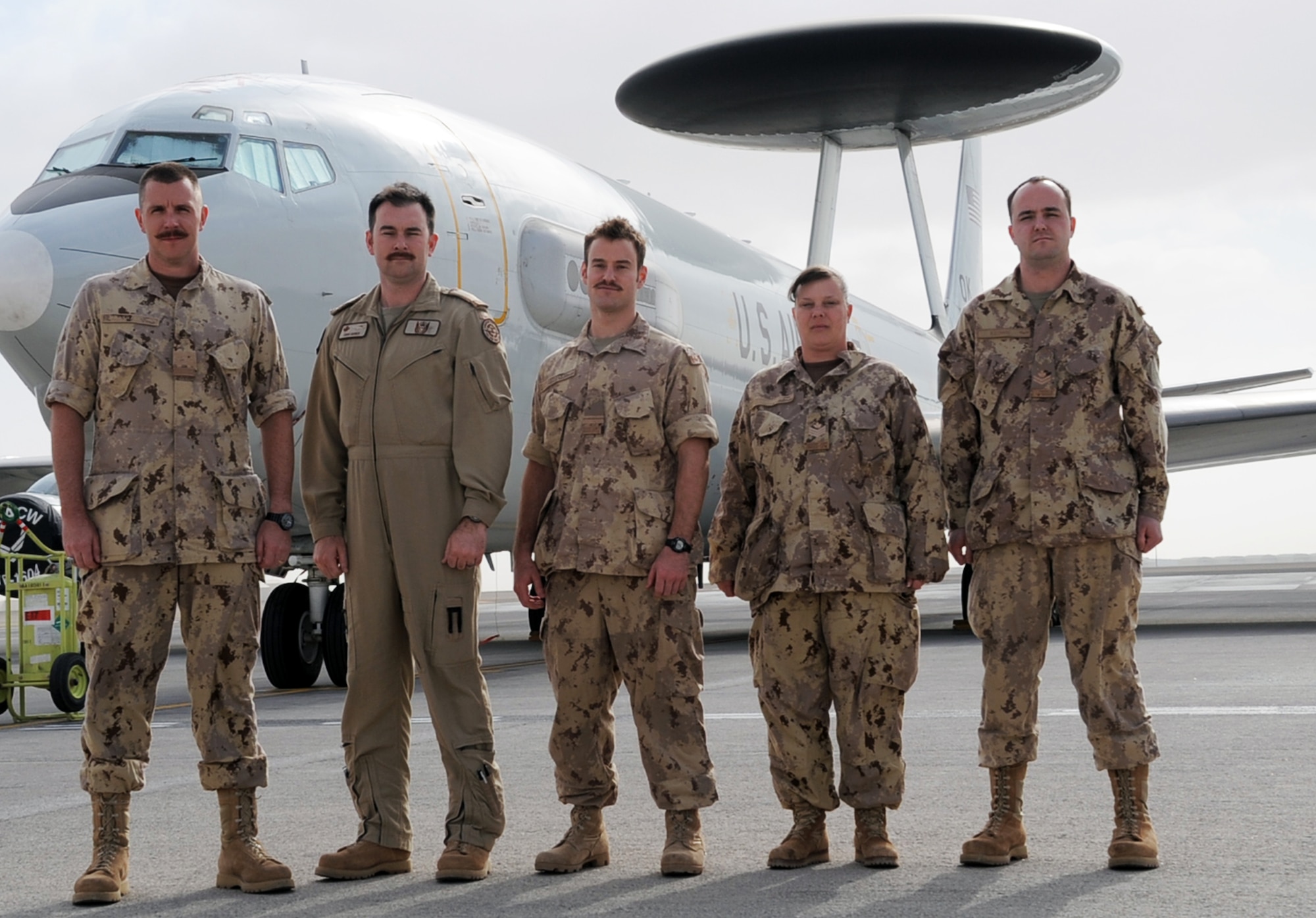 (From left) Maj. Scott Marshall, Capt. Chris Horner, Lt. Will Natynczyk, Sgt. Theresa McLaren, and Master Cpl. Mark Keown, all Canadian Forces members deployed with the 965th Expeditionary Airborne Air Control Squadron, stand at their squadron headquarters at a non-disclosed base in Southwest Asia on Jan. 28, 2010.  The five Canadian Airmen are a part of a crew on an E-3 Sentry Airborne Warning and Control System aircraft deployed from Tinker Air Force Base, Okla. The are a part of the 965th EAACS as part of North American Aerospace Defense Command agreement between the United States and Canada.  (U.S. Air Force Photo/Master Sgt. Scott T. Sturkol/Released)