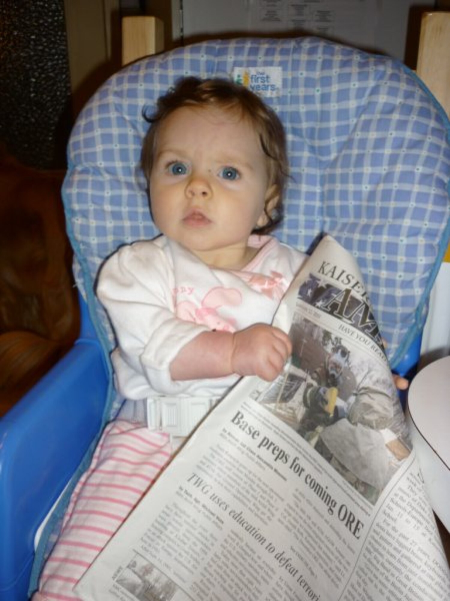 Freedom Leigh Baughman, 7-month-old daughter of U.S. Air Force Tech. Sgt. David Baughman, Ramstein Inspections and Readiness, prepares for the January exercise by reading the Jan. 22, 2010, issue of the Kaiserslautern American. Families of military members assigned to Ramstein Air Base can ready themselves for upcoming operational readiness exercises and the inspection in September by staying current on related events in the paper and on the public Web site at http://www.ramstein.af.mil. (U.S. Air Force photo by Tech. Sgt. David Baughman)