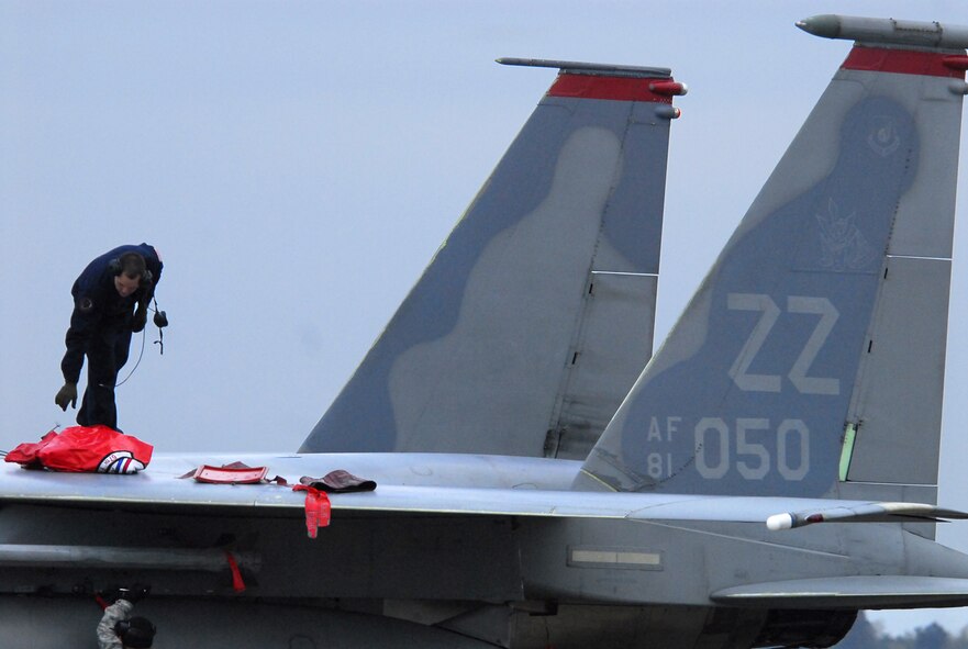 Staff Sgt. Chad Smith, 67th Aircraft Maintenance Unit crew chief, buttons up his F-15 after a sortie Feb. 2. The sortie concluded the second successful day of operations at Hyakuri Air Base, about 70 miles north of Tokyo. Airmen from Kadena are operating from the Japanese base this week as part of an aviation training relocation. The ATR is designed to enhance the interoperability of U.S. and Japan air forces, while reducing flying activities at Kadena on Okinawa. (U.S. Air Force photo / 1st Lt. Bryan Bouchard) 