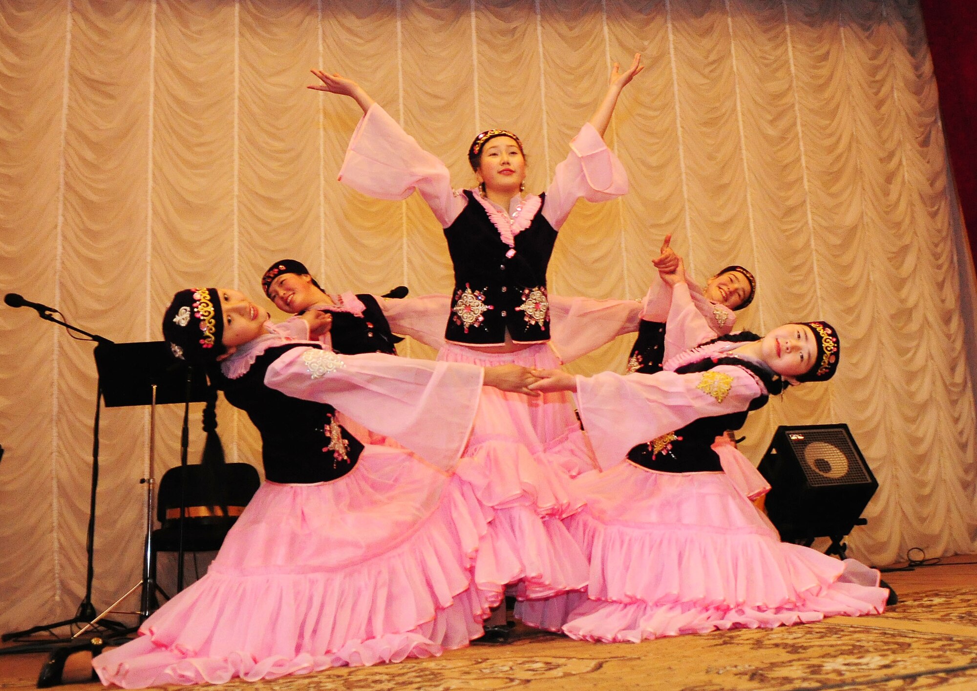 Local dance students, from Tamga Village, perform for the U.S. Air Forces Central band, "Celtic Aire" in Tamga Village, Kyrgyzstan Jan. 29, 2010.  The dancers put on a performance as their way to thank the band for traveling to The House of Culture to perform for the village. (U.S. Air Force photo/Senior Airman Nichelle Anderson/Released)
