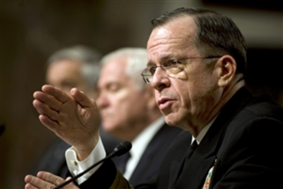 Navy Adm. Mike Mullen, chairman of the Joint Chiefs of Staff, responds to questions during testimony with Defense Secretary Robert M. Gates, center, and Under Secretary of Defense Comptroller Robert Hale before the Senate Armed Services Committee in Washington, D.C., Feb. 2, 2010.  