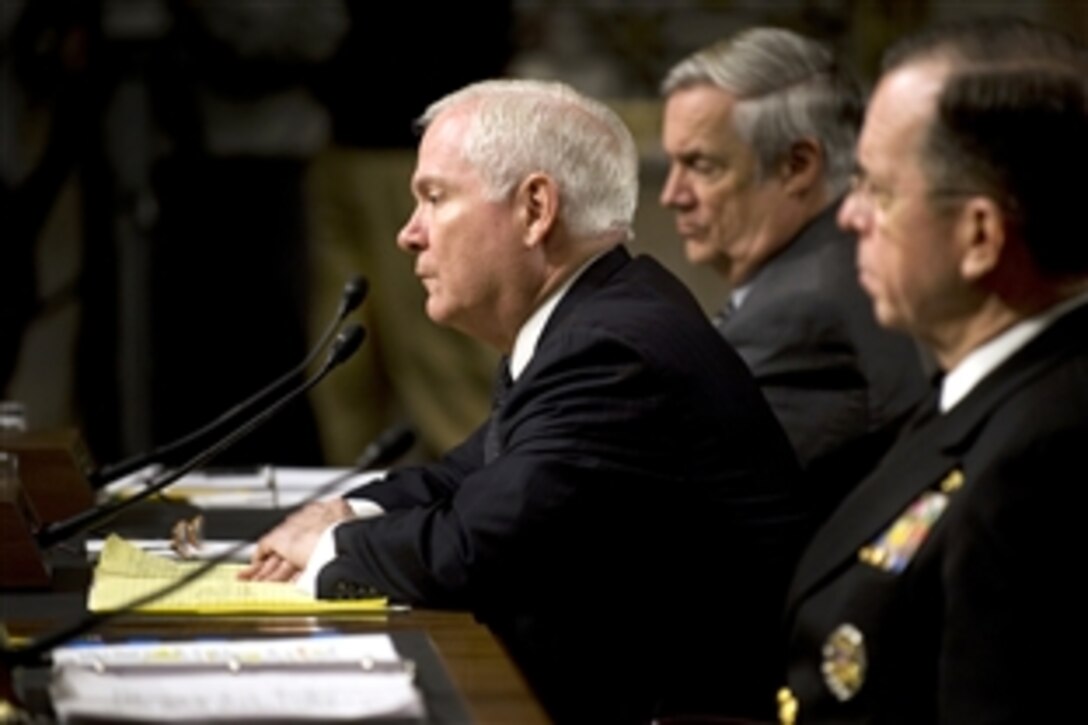 Defense Secretary Robert M. Gates, center, responds to questions during testimony with Under Secretary of Defense Comptroller Robert Hale and Navy Adm. Mike Mullen, chairman of the Joint Chiefs of Staff, before the Senate Armed Services Committee in Washington, D.C., Feb. 2, 2010.  