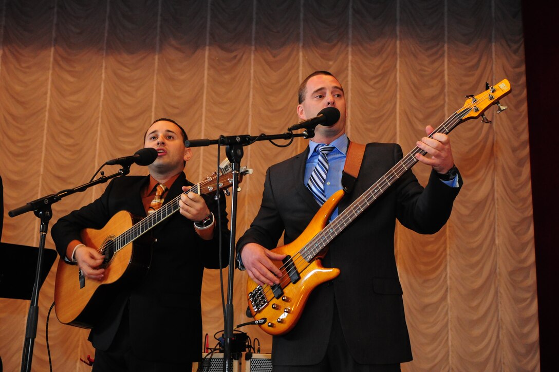 Tech. Sgt. Joseph Haughton and Master Sgt. Eric Sullivan members of the U.S. Air Forces Central Public Affairs band, "Celtic Aire" perform at a concert hall for local villagers in Tamga Village, Kyrgyzstan Jan. 29, 2010  The band, comprised of four members of the ?Singing Sergeants? as well as an accompanying violinist, audio engineer, and officer in charge, is touring Kyrgyzstan for eight days as part of their two-month deployment, and has had the unique opportunity to reach out to local communities. (U.S. Air Force photo/Senior Airman Nichelle Anderson/Released)

