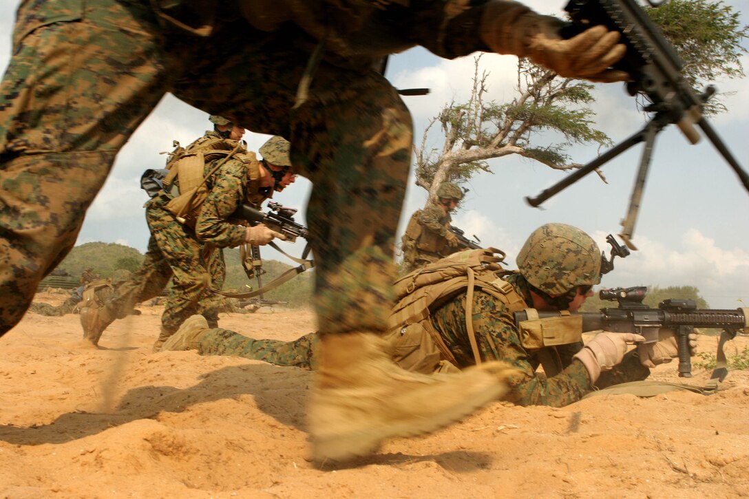 Marines with Battalion Landing Team 2nd Battalion, 7th Marines (BLT 2/7), 31st Marine Expeditionary Unit (MEU), storm the beach after exiting an amphibious assault vehicle (AAV), Feb. 3. The MEU is currently participating in exercise Cobra Gold 2010 (CG’ 10). The exercise is the latest in a continuing series of exercises design to promote regional peace and security. (Official Marine Corps photo by Staff Sgt. Leo A. Salinas)