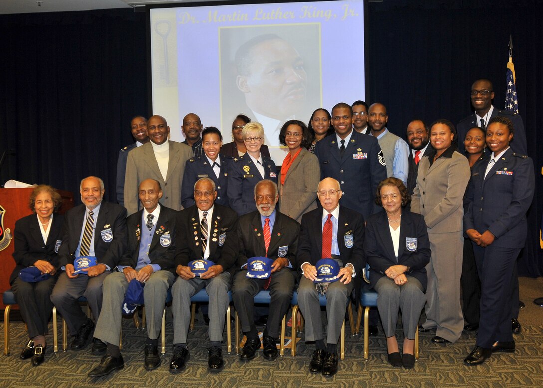 Col. Anita Latin (center), 61st Air Base Wing commander and to her right is Ms. Teri Mathis, Director of Staff office and coordinator for the Dr. Martin Luther King Luncheon held Jan. 14, are joined by  volunteers and staff members.  In front are the serving members of the World War II Tuskegee Airmen. The celebration was held at Los Angeles Air Force Base, Space and Missile Systems Center, El Segundo, Calif. (Photo by  Lou Hernandez)